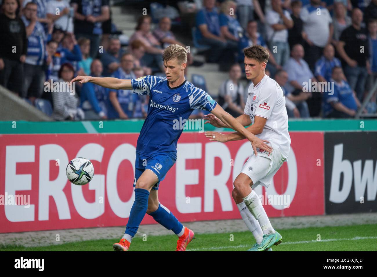 Luca Schuler (left) of 1. FC Magdeburg and Luca Zander (right) of FC St. Pauli vie for the ball during the DFB CUP first round match match between 1. FC Magdeburg and FC St. Pauli at MDCC-Arena on August 07, 2021 in Magdeburg, Germany. (Photo by Peter Niedung/NurPhoto) Stock Photo