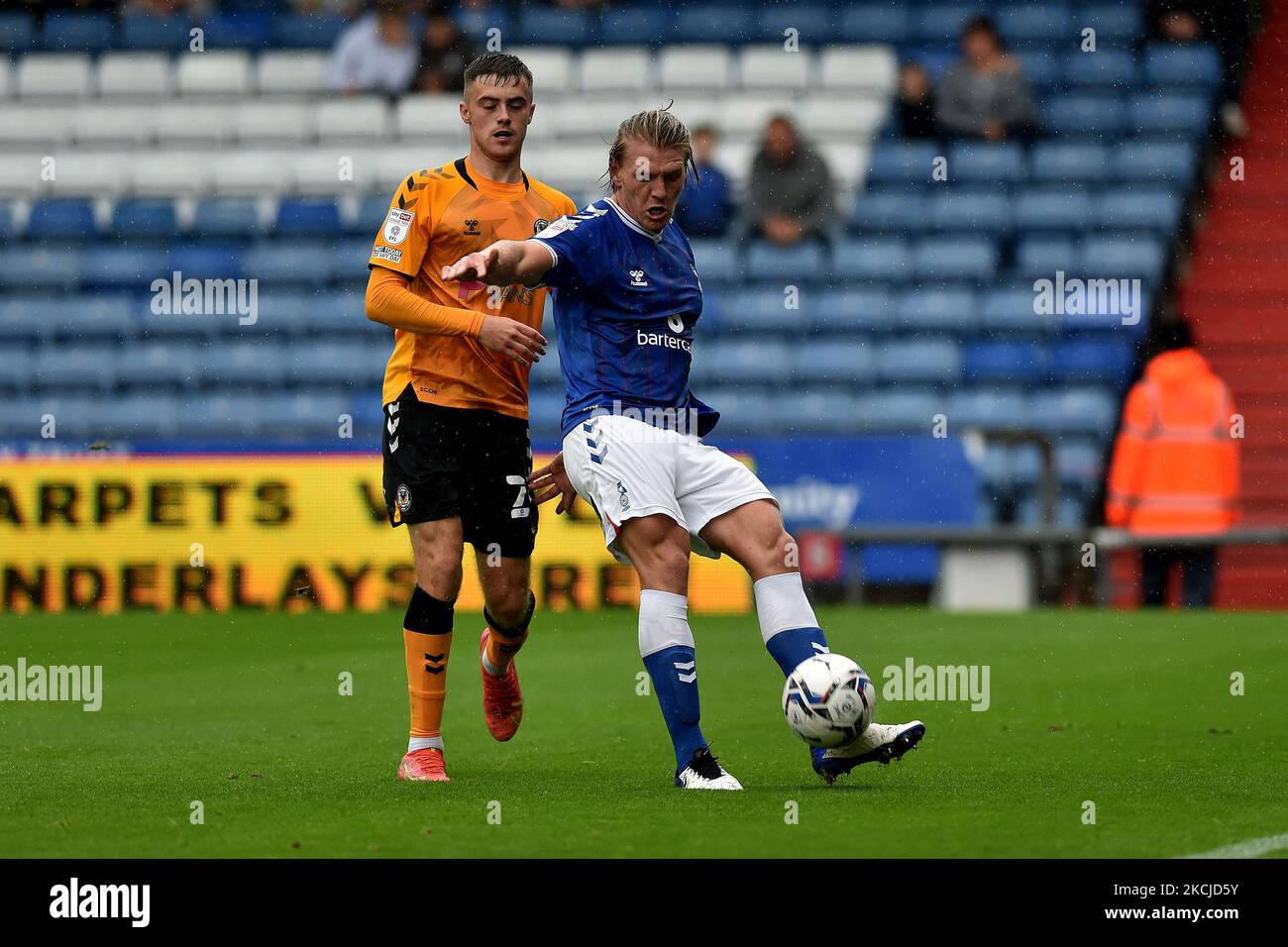Oldham Athletic's Carl Piergianni tussles with Lewis Collins of Newport County during the Sky Bet League 2 match between Oldham Athletic and Newport County at Boundary Park, Oldham, England on 7th August 2021. (Photo by Eddie Garvey/MI News/NurPhoto) Stock Photo