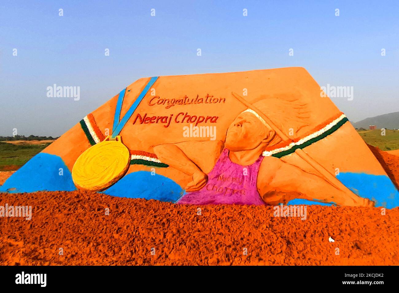Sand Artist Ajay Rawat Create a sand sculpture to Congratulate ''Neeraj Chopra'' for winning the Gold Medal in Tokyo Olympics 2020, in Desert of Pushkar, Rajasthan, India on 08 August 2021. (Photo by Himanshu Sharma/NurPhoto) Stock Photo