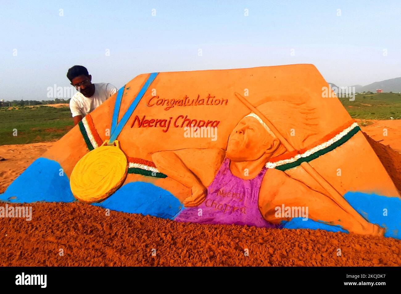 Sand Artist Ajay Rawat Create a sand sculpture to Congratulate ''Neeraj Chopra'' for winning the Gold Medal in Tokyo Olympics 2020, in Desert of Pushkar, Rajasthan, India on 08 August 2021. (Photo by Himanshu Sharma/NurPhoto) Stock Photo