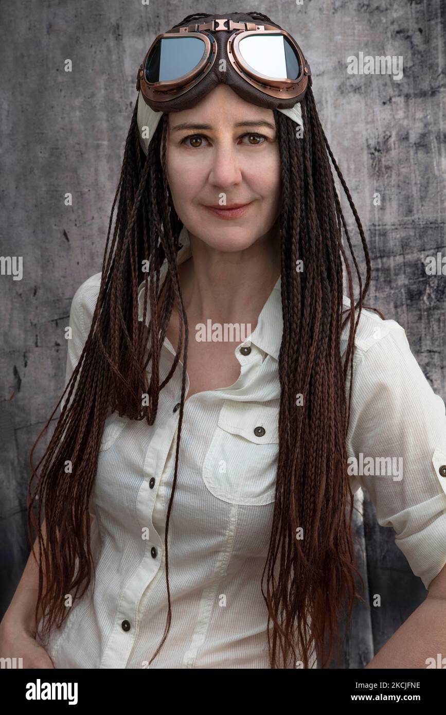 Portrait Of A 50 Year Old Woman In A Vintage Biker Or Aviator Dress