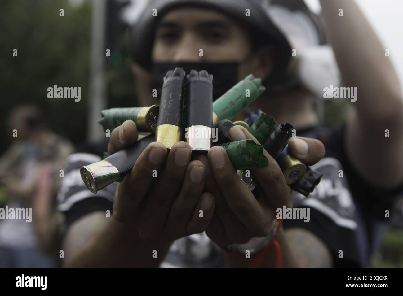 Protesters showed off rubber bullet casings that riot police fired at