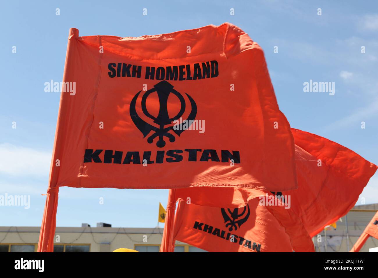 Khalistan flag seen as Canadian Pro-Khalistan Sikhs protest against the Indian government and call for a separate Sikh state called Khalistan in Malton, Ontario, Canada, on May 06, 2012. Thousands of Sikhs attended a Nagar Kirtan to celebrate Vaisakhi and to show their discontent with the Indian government. The Khalistan movement refers to a movement which seeks to create a separate Sikh state, called Khalistan in the Punjab region of India. The territorial definition of the proposed nation is disputed, with some believing it should be carved simply out of the Indian state of Punjab, where Sik Stock Photo