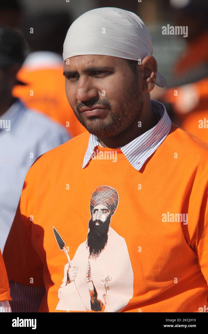 Canadian Sikh man wearing a T-shirt with the image of Jarnail Singh Bhindranwale (a controversial figure in Indian history whom the Sikhs consider to be a great martyr and is regarded by others as a militant figure) in Malton, Ontario, Canada, on May 05, 2013. Jarnail Singh Bhindranwale and his followers initiated a movement for a separate Sikh state named 'Khalistan' after the 1984 storming of the Golden Temple by the Indian Armed Forces which resulted in the deaths of thousands of Sikhs. The Khalistan movement has been declared a terrorist movement by the Government of India is illegal withi Stock Photo