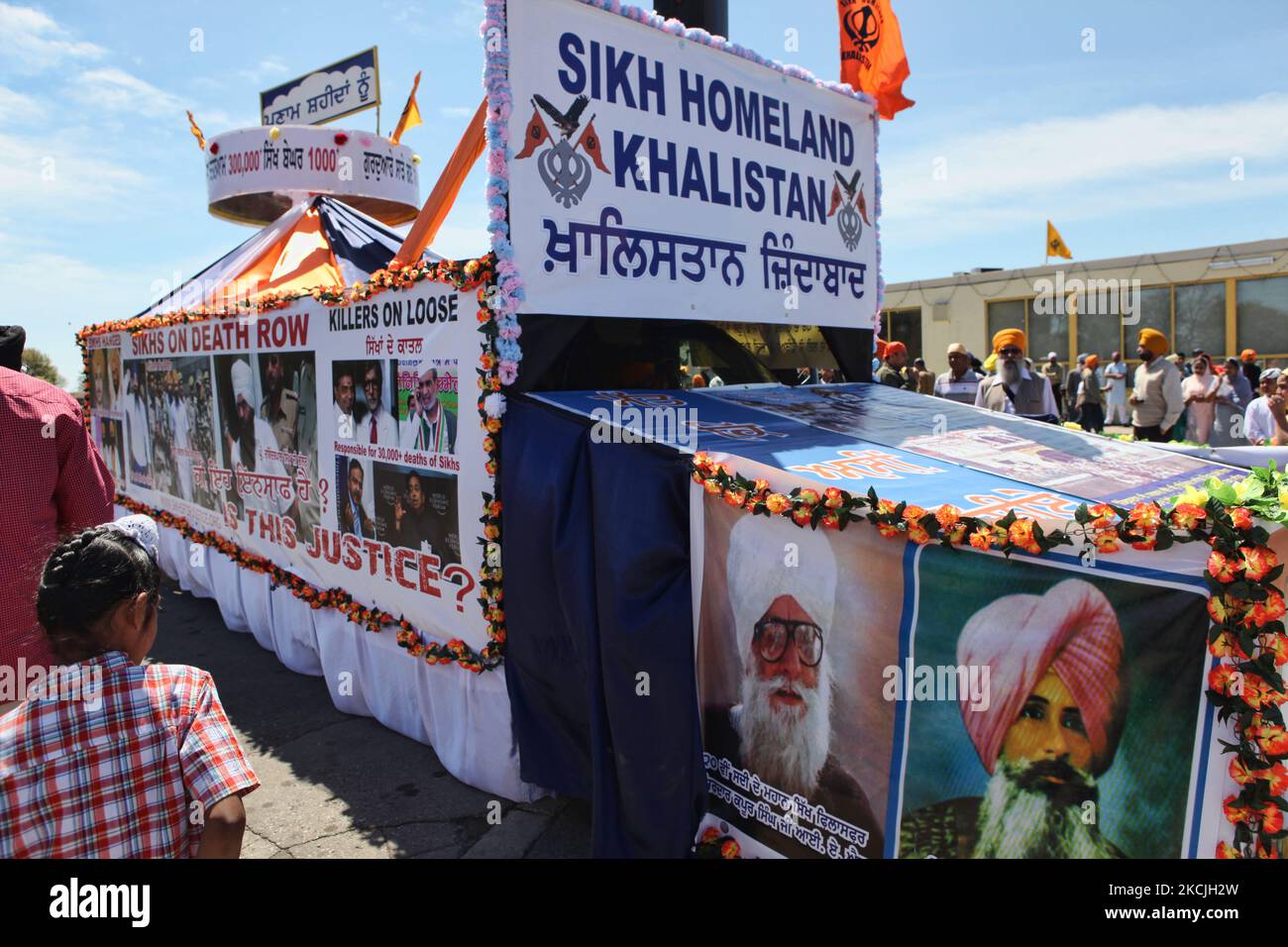 Canadian Pro-Khalistan Sikhs protest against the Indian government in Malton, Mississauga, Ontario, Canada, on May 06, 2012. Thousands of Sikhs attended a Nagar Kirtan to celebrate Vaisakhi and to show their discontent with the Indian government. The Khalistan movement refers to a movement which seeks to create a separate Sikh state, called Khalistan in the Punjab region of India. The territorial definition of the proposed nation is disputed, with some believing it should be carved simply out of the Indian state of Punjab, where Sikhs are the majority population. The Khalistan movement has bee Stock Photo