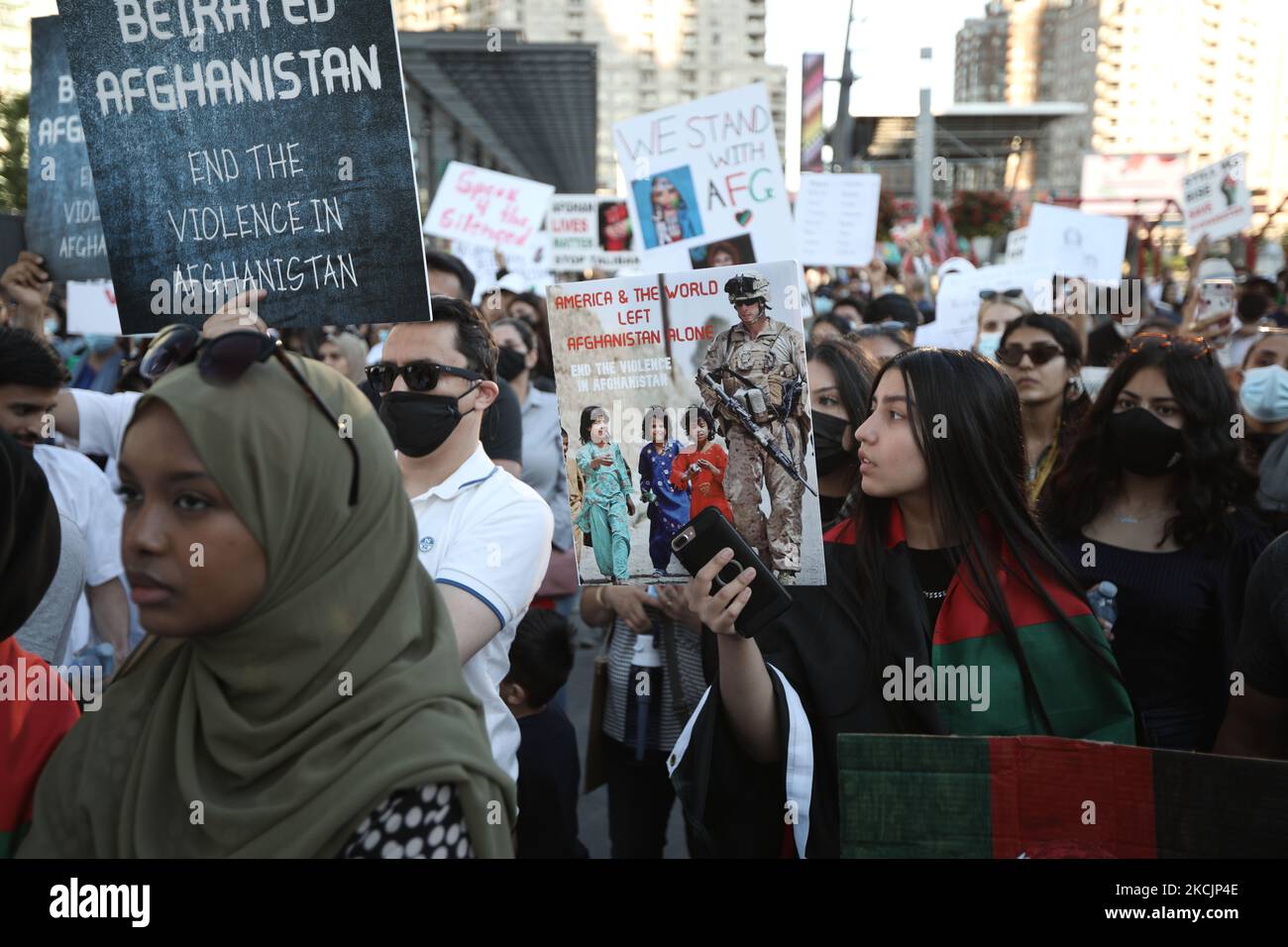 Dozens of Afghan gathered for a rally in solidarity with their ...