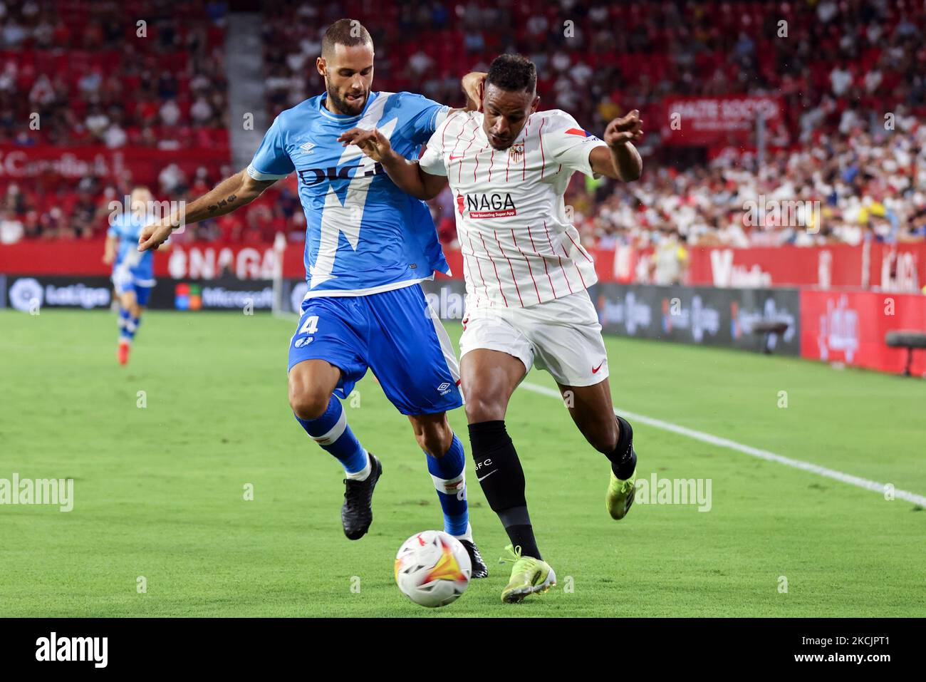 Fernando Reges of Sevilla CF in action with Mario Suarez of Rayo Vallecano de Madrid during the La Liga Santader match between Sevilla CF and Rayo Vallecano de Madrid at Ramon Sanchez Pizjuan in Seville, Spain, on August 15, 2021. (Photo by Jose Luis Contrearas/DAX Images/NurPhoto) Stock Photo