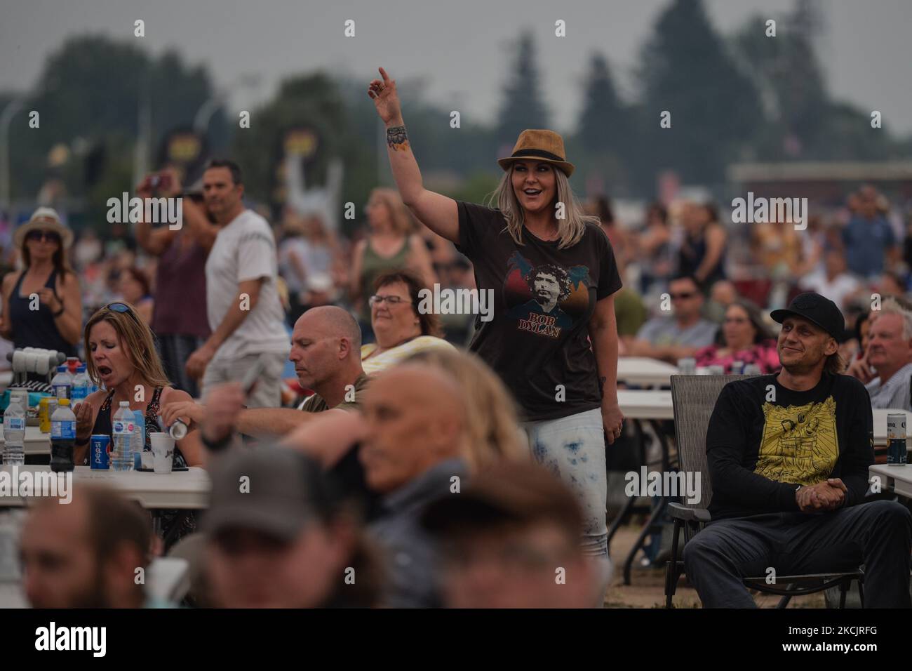 Members of the public enjoy the Glass Tiger live performance at Edmonton Rock Fest, a part of the Together Again series at the historic Racetrack Infield on the Edmonton Exhibition Lands (formerly Northlands Park) in Edmonton. On Saturday, 14 August 2021, in Edmonton, Alberta, Canada. (Photo by Artur Widak/NurPhoto) Stock Photo