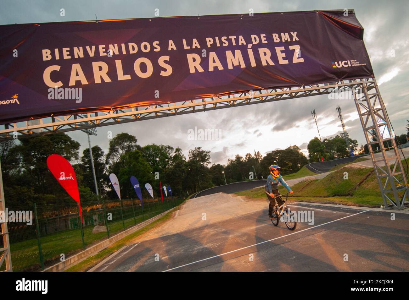 A Bogota BMX team member passes the finish line of the Carlos Ramirez BMX Course during the name inauguration of the Carlos Ramirez BMX track named after Carlos Ramirez bronze Olympic Medal winner during the Tokyo 2020+1 Olympics, in Bogota, Colombia, on August 18, 2021. (Photo by Sebastian Barros/NurPhoto) Stock Photo