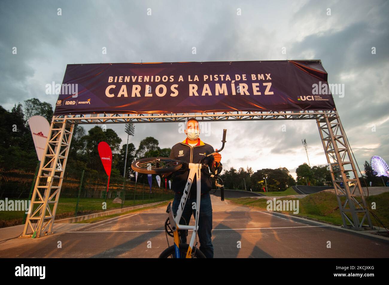 Carlos Ramirez poses for a photo with his bike at the finishline of the Carlos Ramirez BMX Track during the name inauguration of the Carlos Ramirez BMX track named after Carlos Ramirez bronze Olympic Medal winner during the Tokyo 2020+1 Olympics, in Bogota, Colombia, on August 18, 2021. (Photo by Sebastian Barros/NurPhoto) Stock Photo
