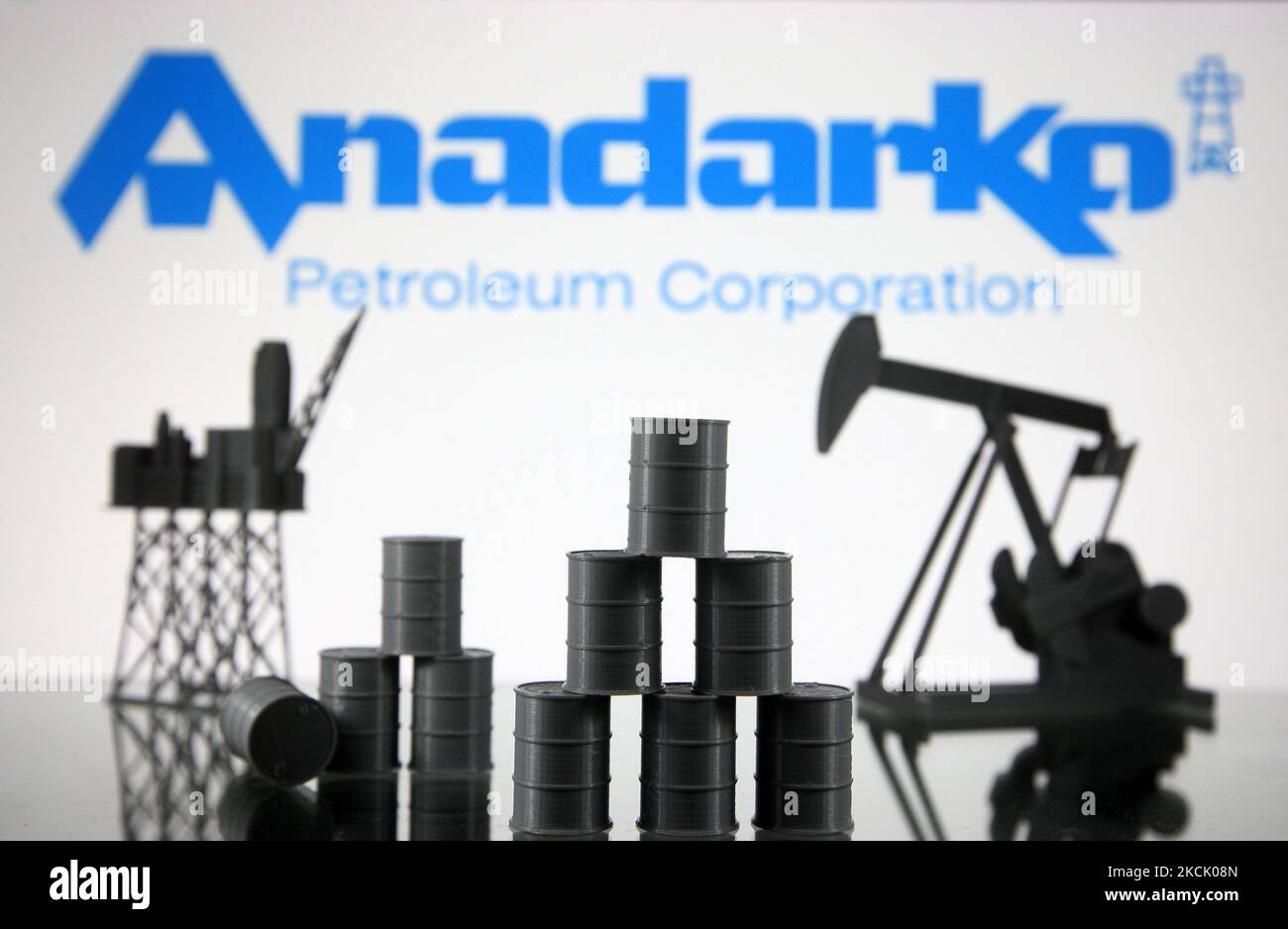 Anadarko Petroleum Corporation logo and models of an oil rig, pump jack and oil barrels are pictured in this illustration photo taken in Kyiv on 19 August, 2021. (Photo by STR/NurPhoto) Stock Photo