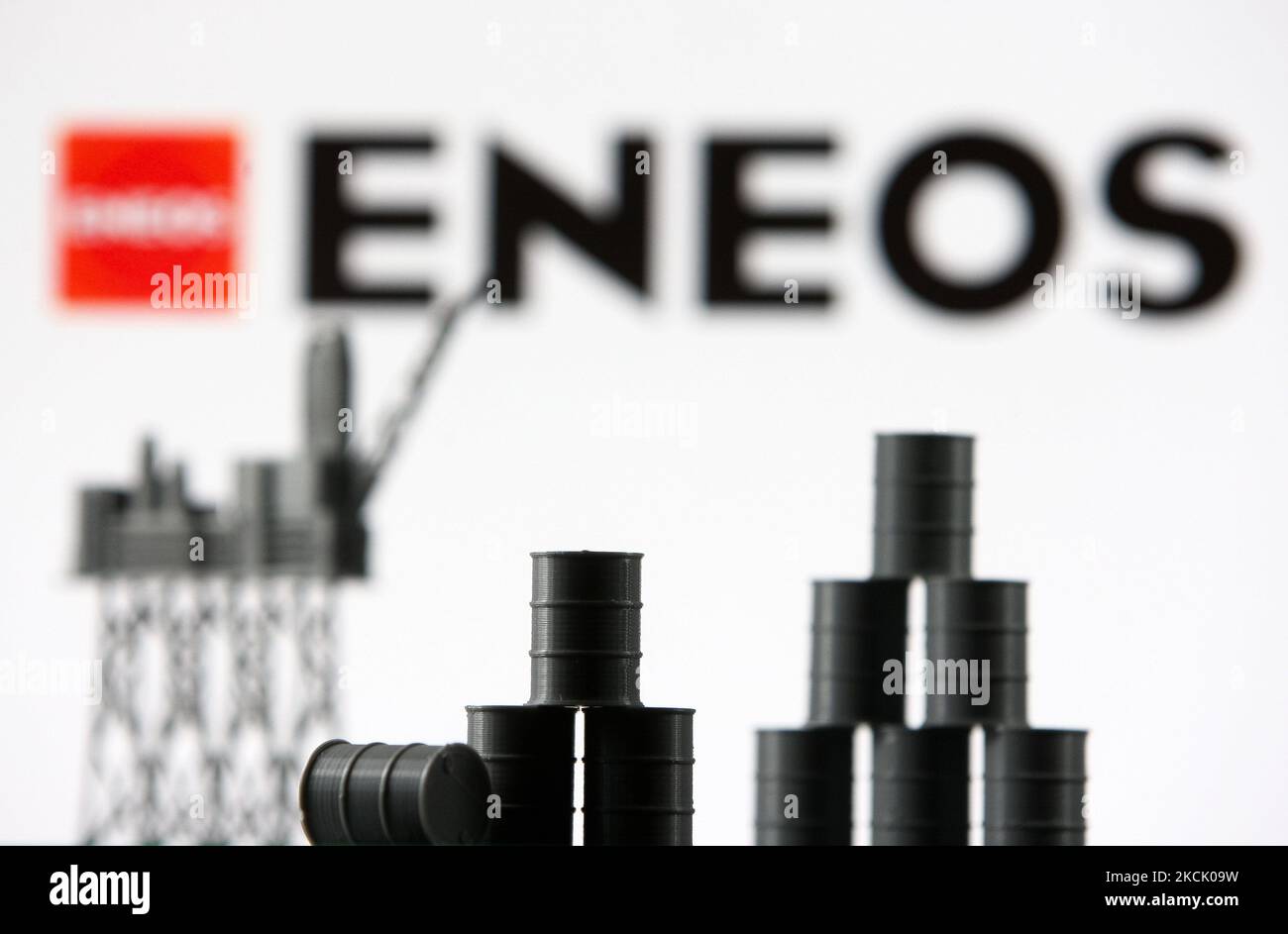 ENEOS Corporation logo and models of an oil rig and oil barrels are ...