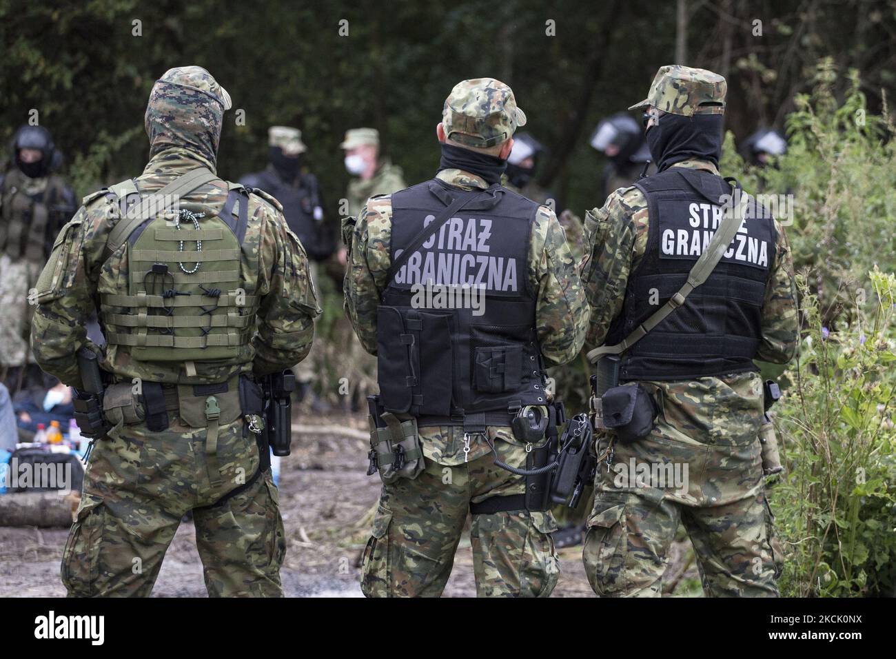 Bobrder Police officers seen in makeshift camp after illegal border crossing in Usnarz Gorny on August 19, 2021. (Photo by Maciej Luczniewski/NurPhoto) Stock Photo