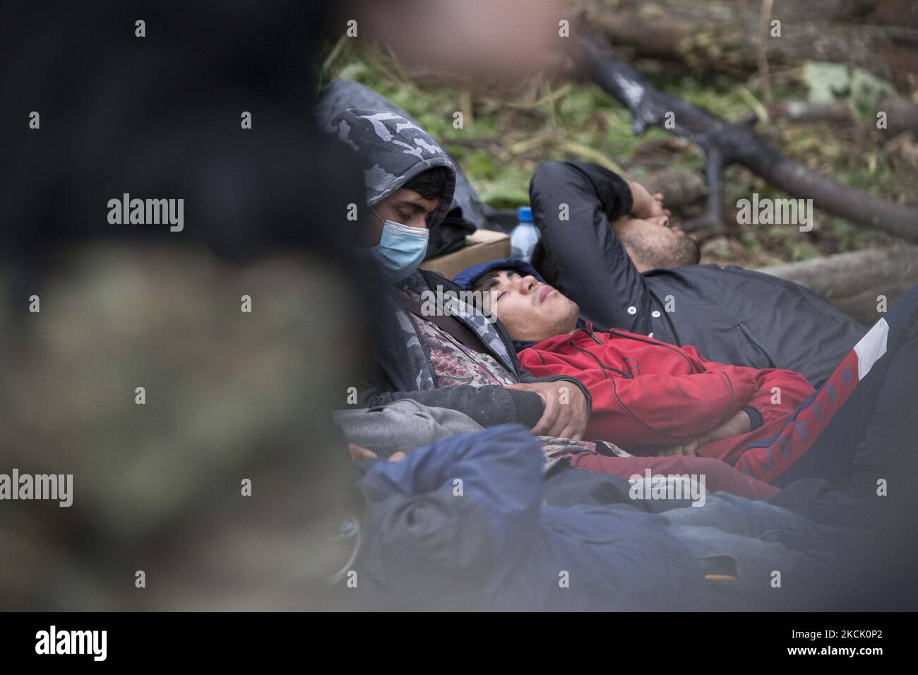 A refugees seen in makeshift camp after illegal border crossing in Usnarz Gorny on August 19, 2021. (Photo by Maciej Luczniewski/NurPhoto) Stock Photo
