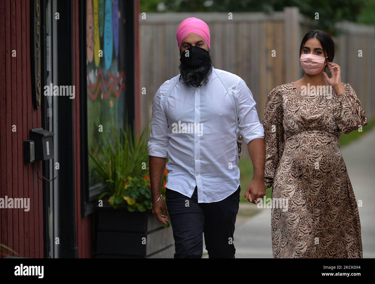 Jagmeet Singh, leader of the New Democratic Party, and his wife Gurkiran Kaur Sidhu, on their way to visit local businesses with Edmonton NDP candidates Blake Desjarlais and Heather McPherson, during today's campaign in Alberta. On Thursday, 19 August 2021, in Edmonton, Alberta, Canada. (Photo by Artur Widak/NurPhoto) Stock Photo