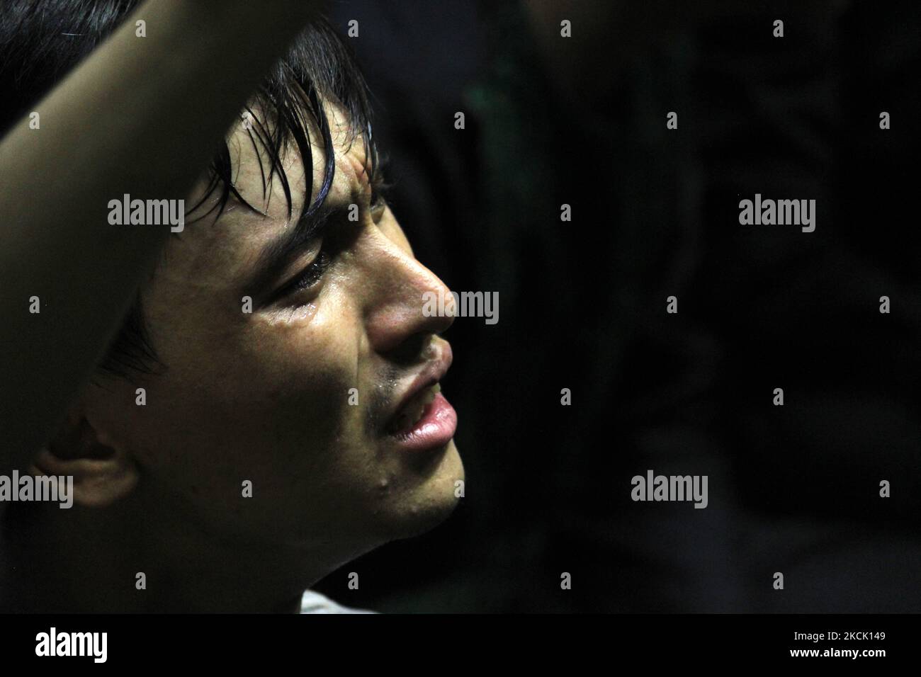 An Afghan Shi'ite Muslim refugee living in India mourns during a procession to mark Ashura- the death anniversary of Imam Hussein, the grandson of Prophet Mohammad, in New Delhi, India on August 20, 2021. (Photo by Mayank Makhija/NurPhoto) Stock Photo