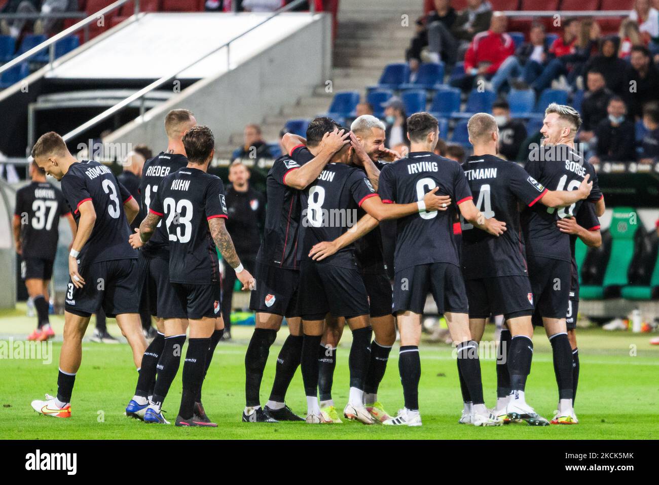 Albion Vrenezi of Tuerkguecue Muenchen celebrates with teammates after scoring his team's third goal during the 3. Liga match between TSV Havelse and Tuerkguecue Muenchen at HDI-Arena on August 25, 2021 in Hanover, Germany. (Photo by Peter Niedung/NurPhoto) Stock Photo