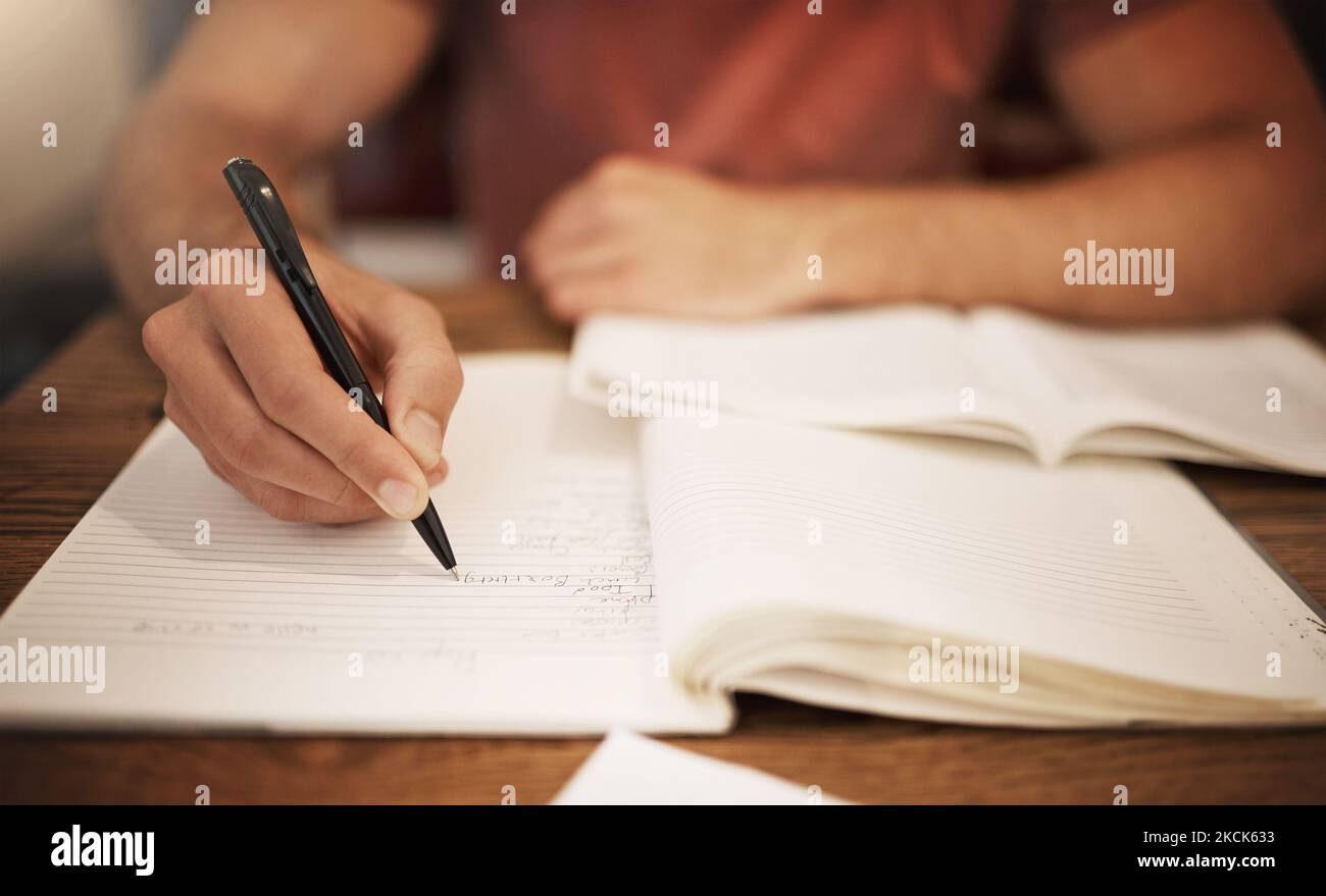 Making note of the most important points. an unrecognizable young male ...