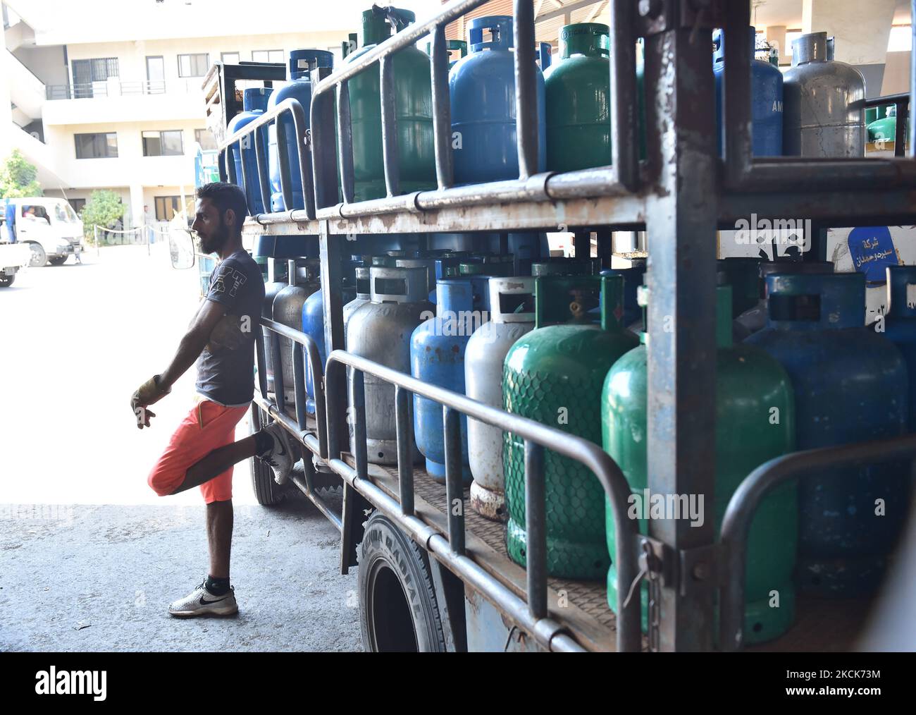 Residents queue outside a gas distribution station to fill gas cylinders in Beirut, Lebanon, on