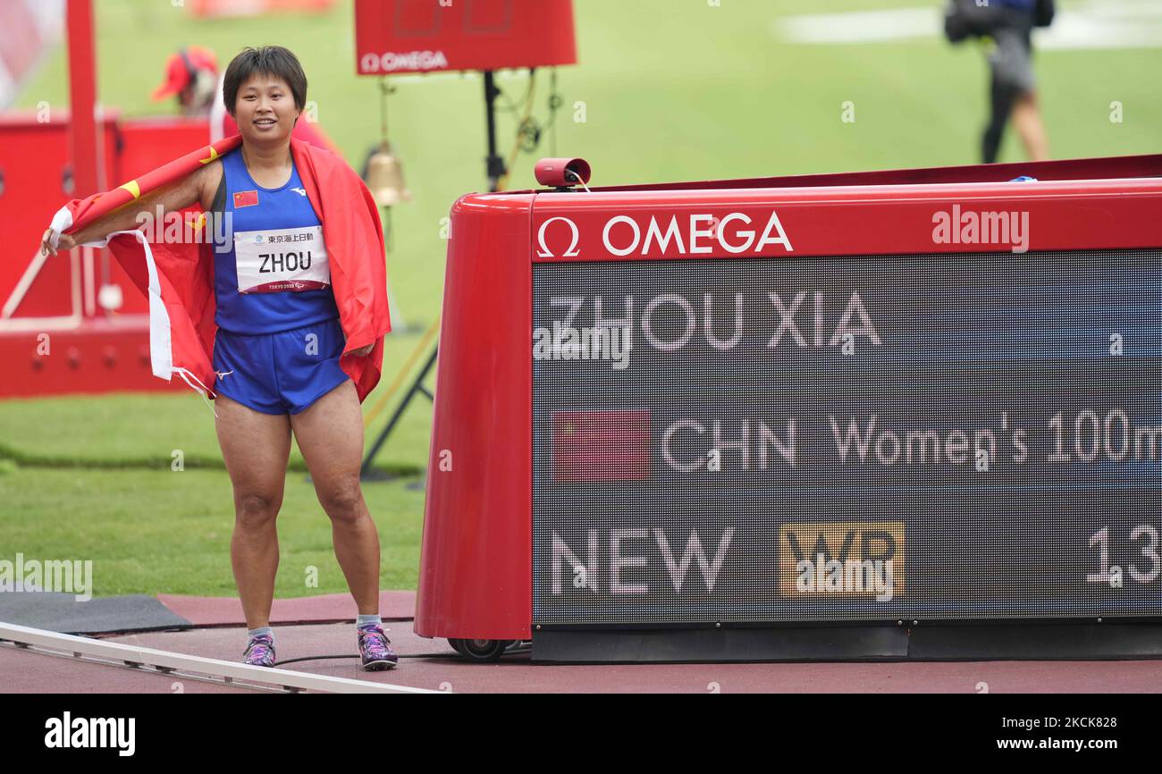 Xia Zhou from China winning gold at 100m and beating the world record ...