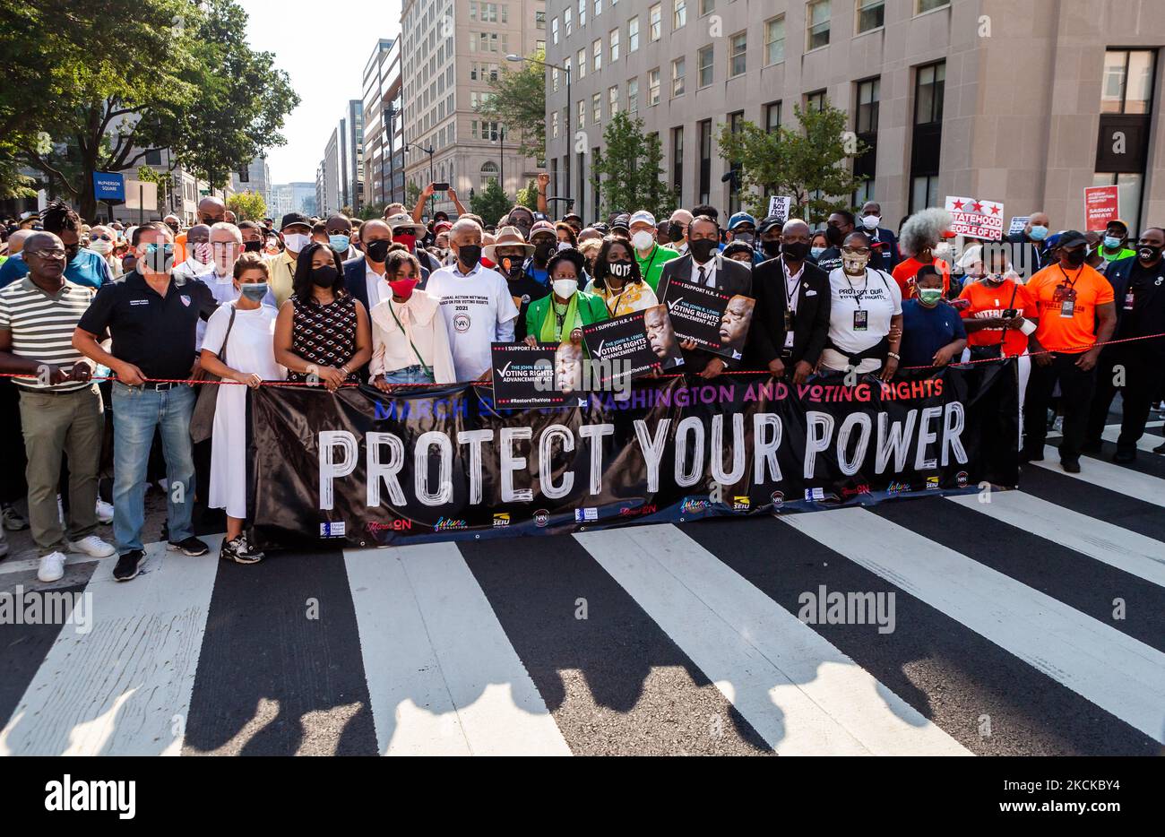 Rev. Al Sharpton, Martin Luther King III, Representatives, and others await the beginning of the march at the flagship event of a nationwide action for voting rights on the 58th anniversary of the March on Washington. Participating individuals and organizations demand an end to the filibuster and passage of the John Lewis Voting Rights Advancement Act and the For the People act to ensure federal protection of the right to vote. The event is sponsored by the Drum Major Institute, March On, SEIU, National Action Network, and Future Coalition, and has more than 225 partner organizations. (Photo b Stock Photo