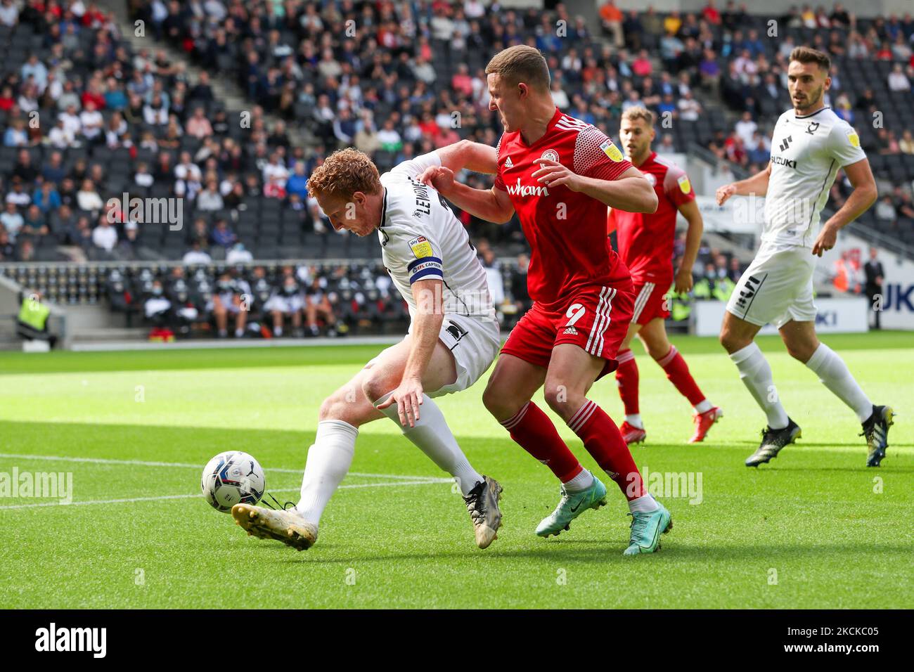 Milton Keynes Dons captain Dean Lewington covers the ball from Accrington Stanley's Colby Bishop during the first half of the Sky Bet League One match between MK Dons and Accrington Stanley at Stadium MK, Milton Keynes on Saturday 28th August 2021. (Photo by John Cripps/MI News/NurPhoto) Stock Photo