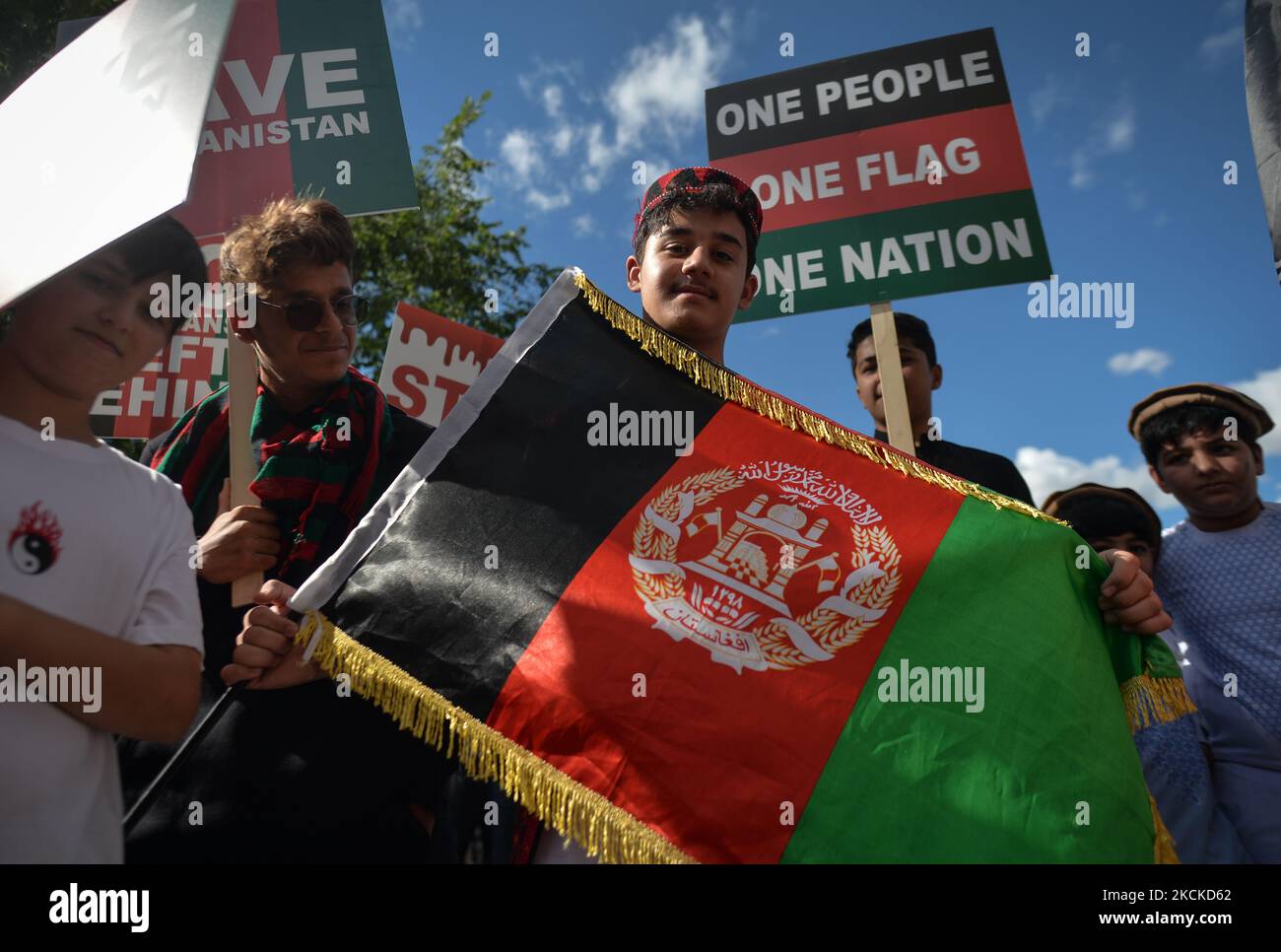 Protester holds the national flag of Afghanistan. Members of the local Afghan diaspora, activists and local supporters seen in front of the Alberta Legislature Building during the STOP KILLING AFGHANS! protest organised today by the Global Movement of Peace for Afghanistan. Saturday, August 28, 2021, in Edmonton, Alberta, Canada. (Photo by Artur Widak/NurPhoto) Stock Photo