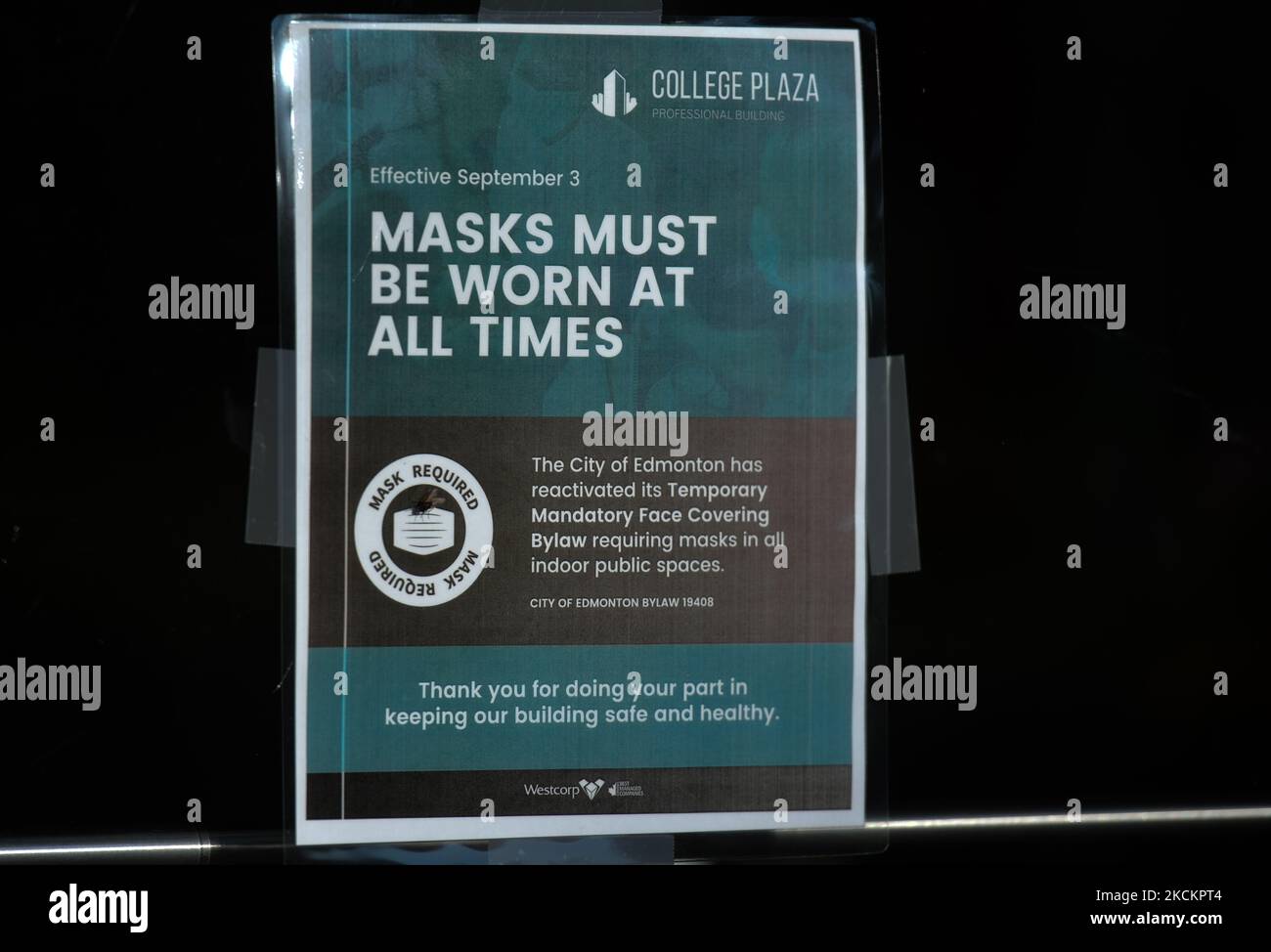 Sign 'Masks Must Be Worn At All Times' seen at the entrance to a store