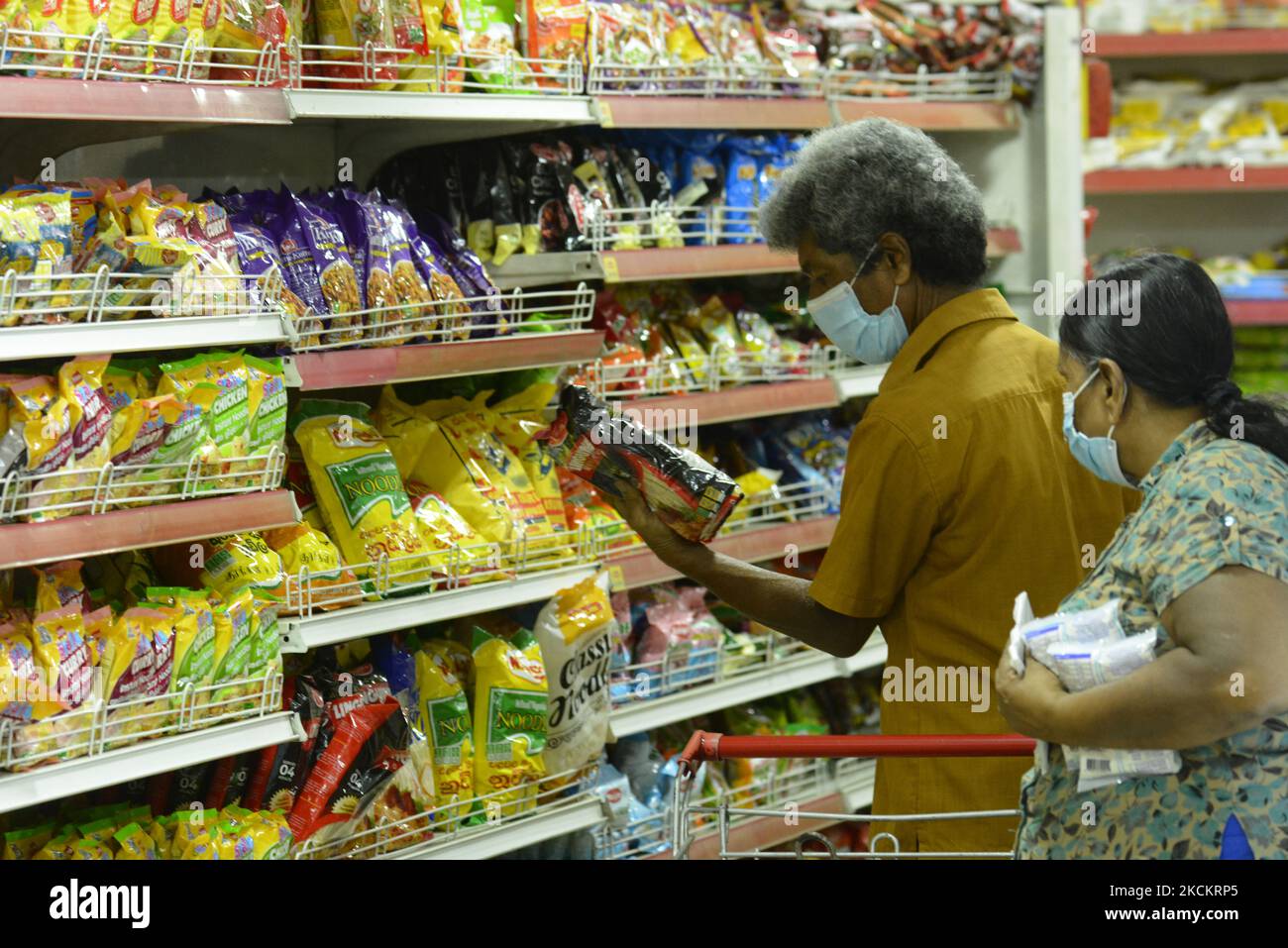 People buying essential food items at the supermarket near after the