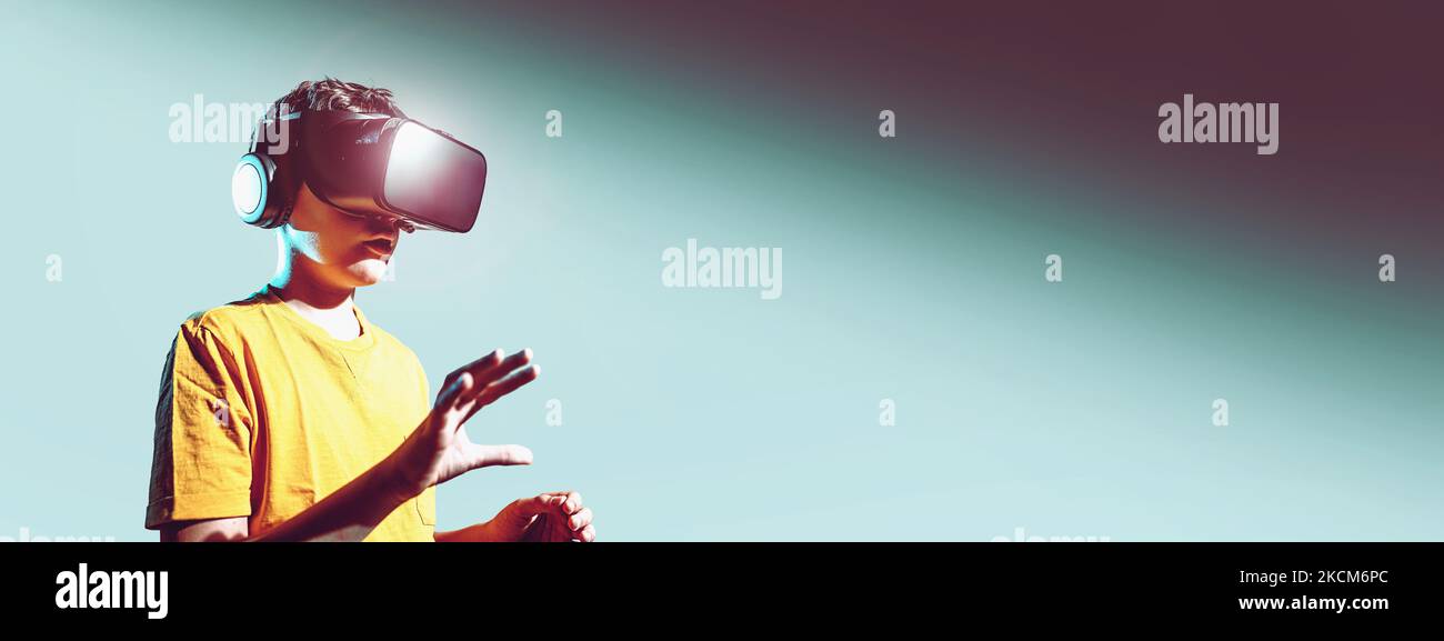 Little Boy In T Shirt Is Wearing 3d Vr Helmet Horizontal Graphic Little boy in t shirt is wearing 3d vr helmet horizontal graphic