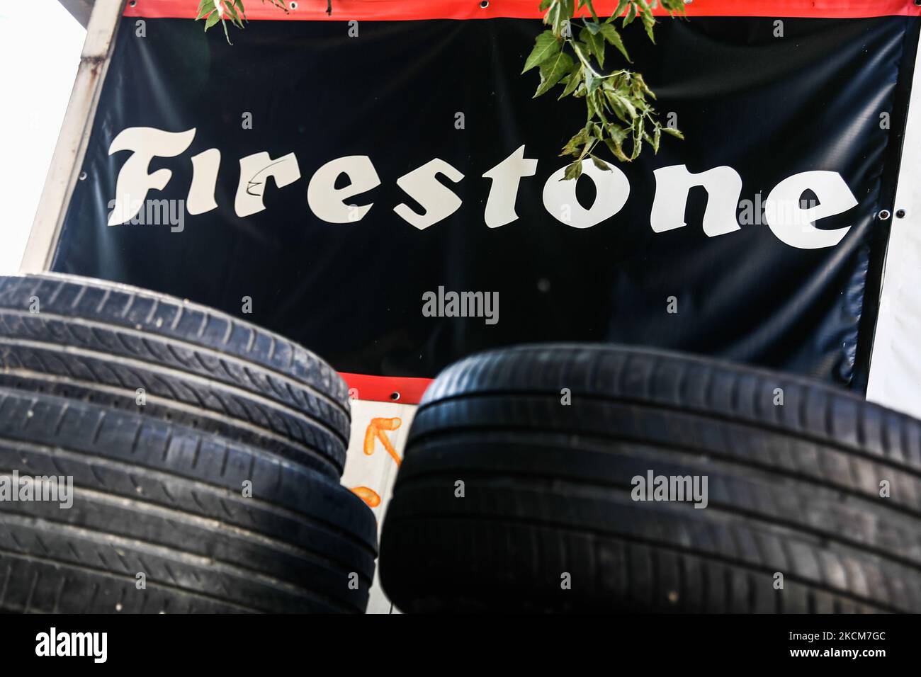 Tyres and Firestone logo are seen near the car service in Krakow, Poland on September 9, 2021. (Photo by Jakub Porzycki/NurPhoto) Stock Photo