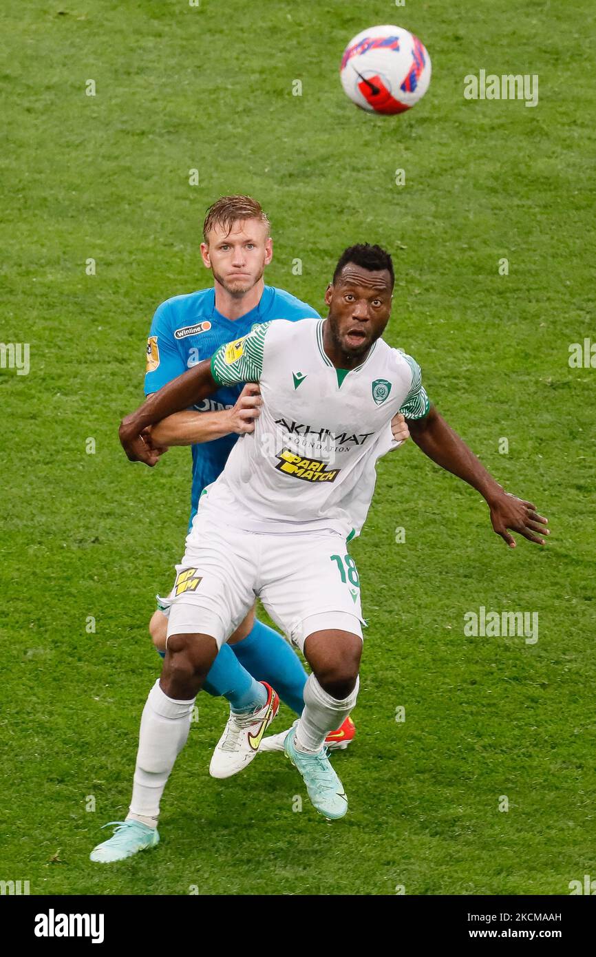 Dmitri Chistyakov (L) of Zenit and Senin Sebai of Akhmat vie for the ball during the Russian Premier League match between FC Zenit Saint Petersburg and FC Akhmat Grozny on September 11, 2021 at Gazprom Arena in Saint Petersburg, Russia. (Photo by Mike Kireev/NurPhoto) Stock Photo