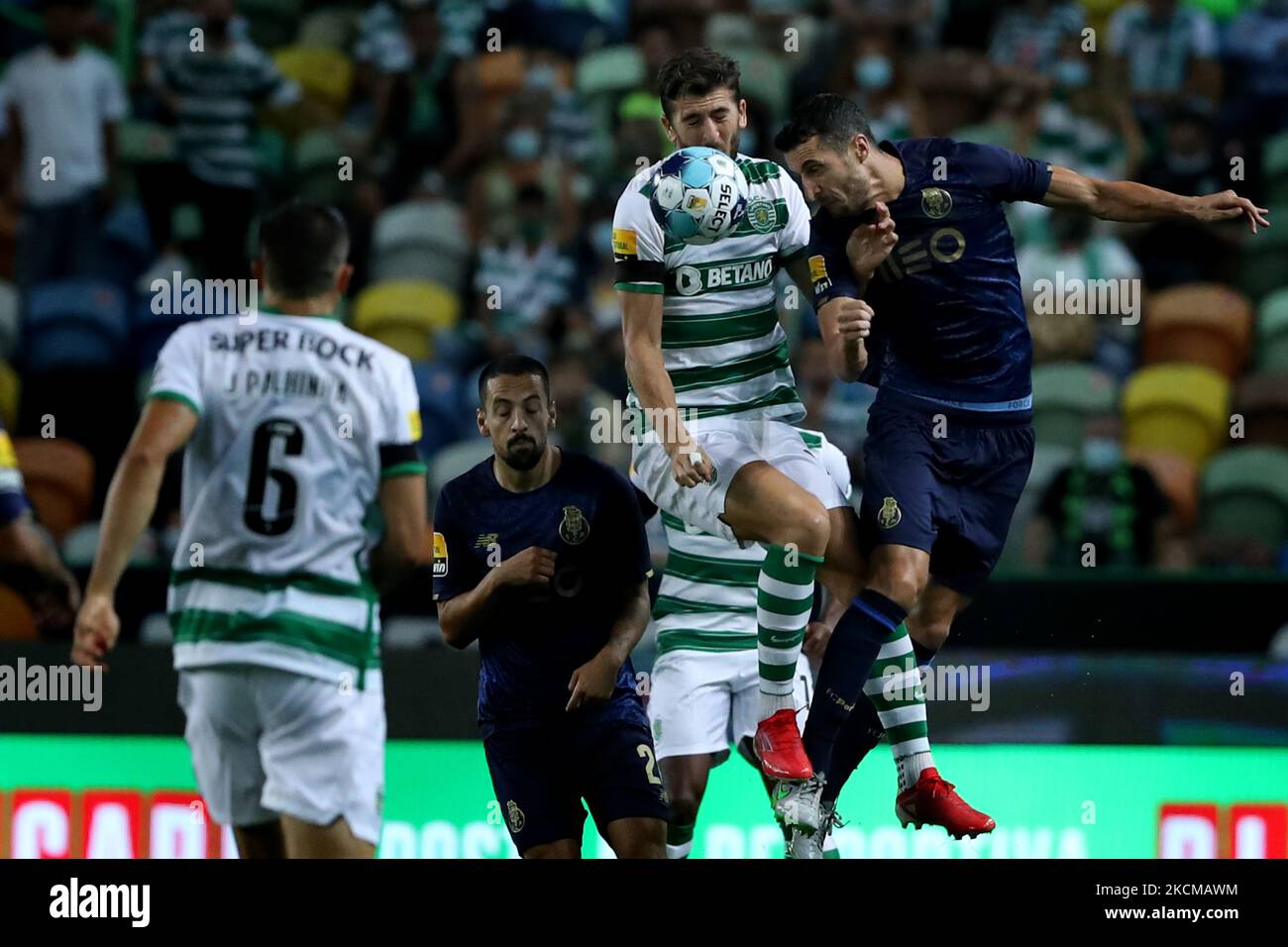 Ivan Marcano of FC Porto (R ) vies with Paulinho of Sporting CP during the Portuguese League football match between Sporting CP and FC Porto at Jose Alvalade stadium in Lisbon, Portugal on September 11, 2021. (Photo by Pedro FiÃºza/NurPhoto) Stock Photo