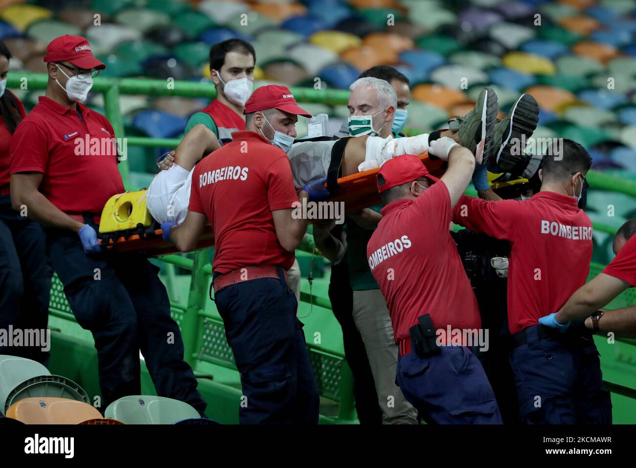 A Sporting fan is taken out on a stretcher by firefighters after falling from the top stand during the Portuguese League football match between Sporting CP and FC Porto at Jose Alvalade stadium in Lisbon, Portugal on September 11, 2021. (Photo by Pedro FiÃºza/NurPhoto) Stock Photo