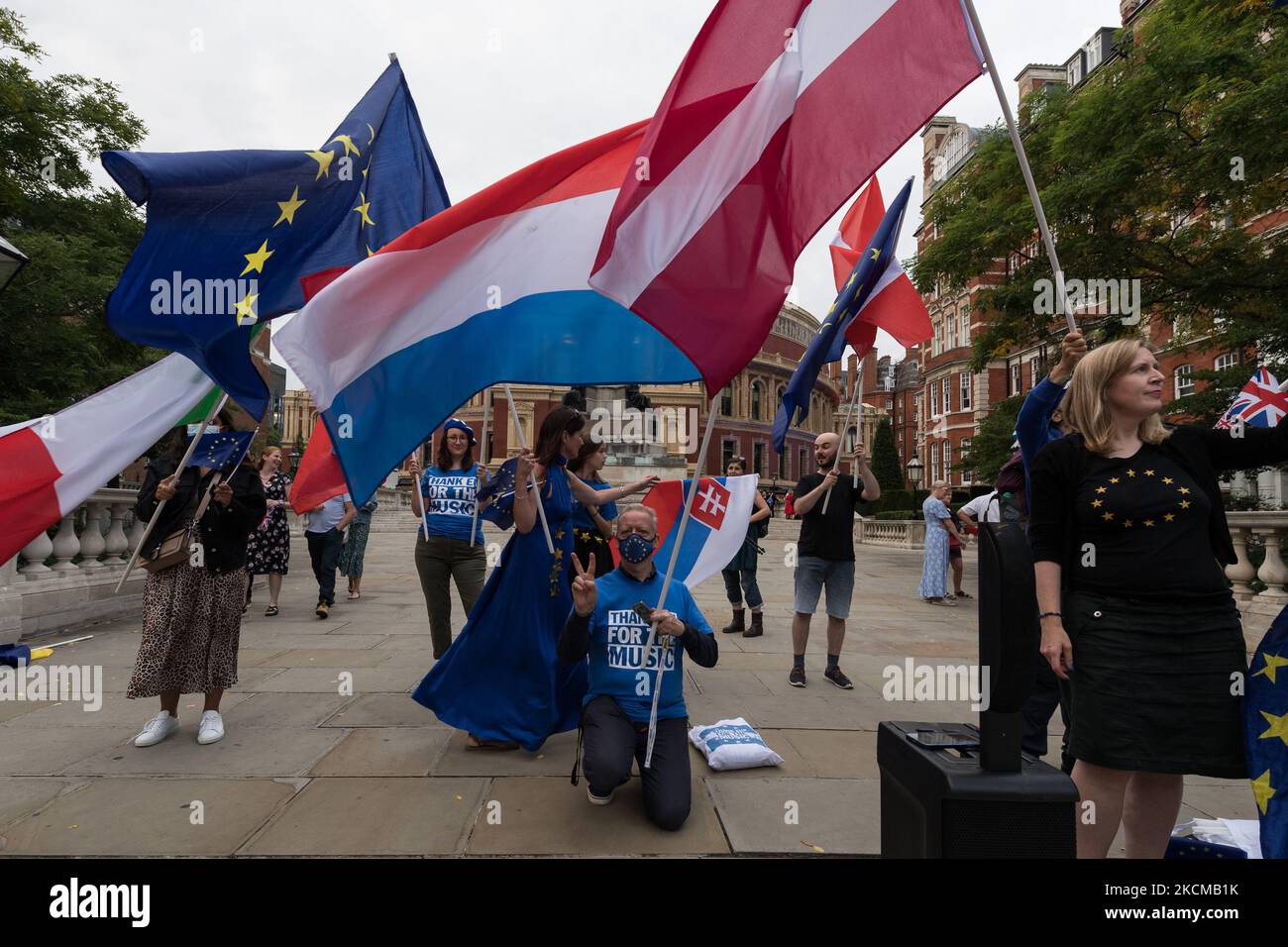 LONDON, UNITED KINGDOM - SEPTEMBER 11, 2021: Pro-EU activists and musicians wave flags of EU and its member states outside Royal Albert Hall ahead of the Last Night of the Proms to highlight lack of post-Brexit agreement for touring arts on September 11, 2021 in London, England. The campaigners call for the government to introduce a transitional support package to cover the additional post-Brexit expenses before securing an EU-wide touring artists visa waiver. (Photo by WIktor Szymanowicz/NurPhoto) Stock Photo