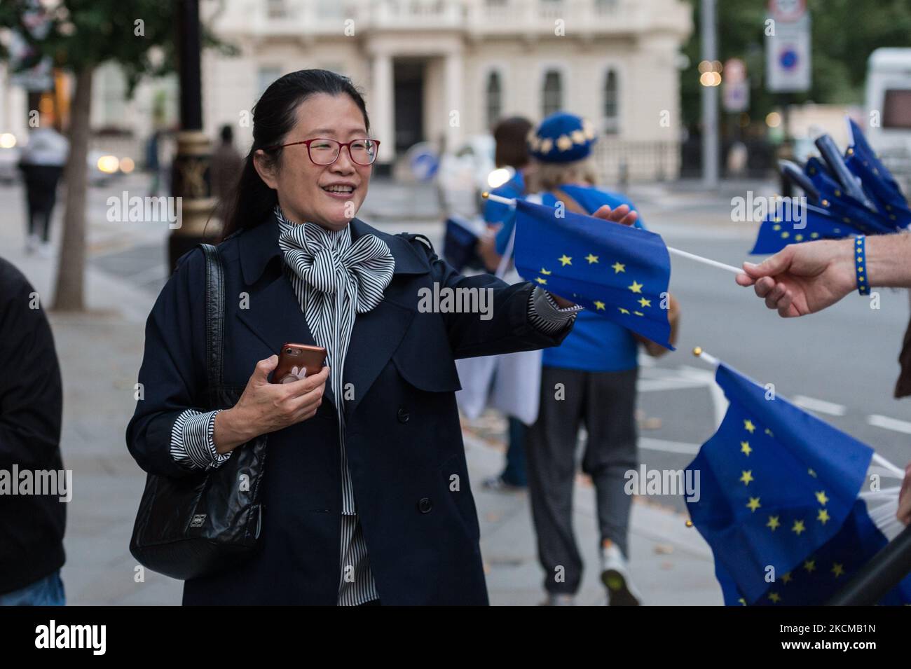 LONDON, UNITED KINGDOM - SEPTEMBER 11, 2021: Pro-EU activists hand out flags to concert-goers outside Royal Albert Hall ahead of the Last Night of the Proms to highlight lack of post-Brexit agreement for touring arts on September 11, 2021 in London, England. The campaigners call for the government to introduce a transitional support package to cover the additional post-Brexit expenses before securing an EU-wide touring artists visa waiver. (Photo by WIktor Szymanowicz/NurPhoto) Stock Photo