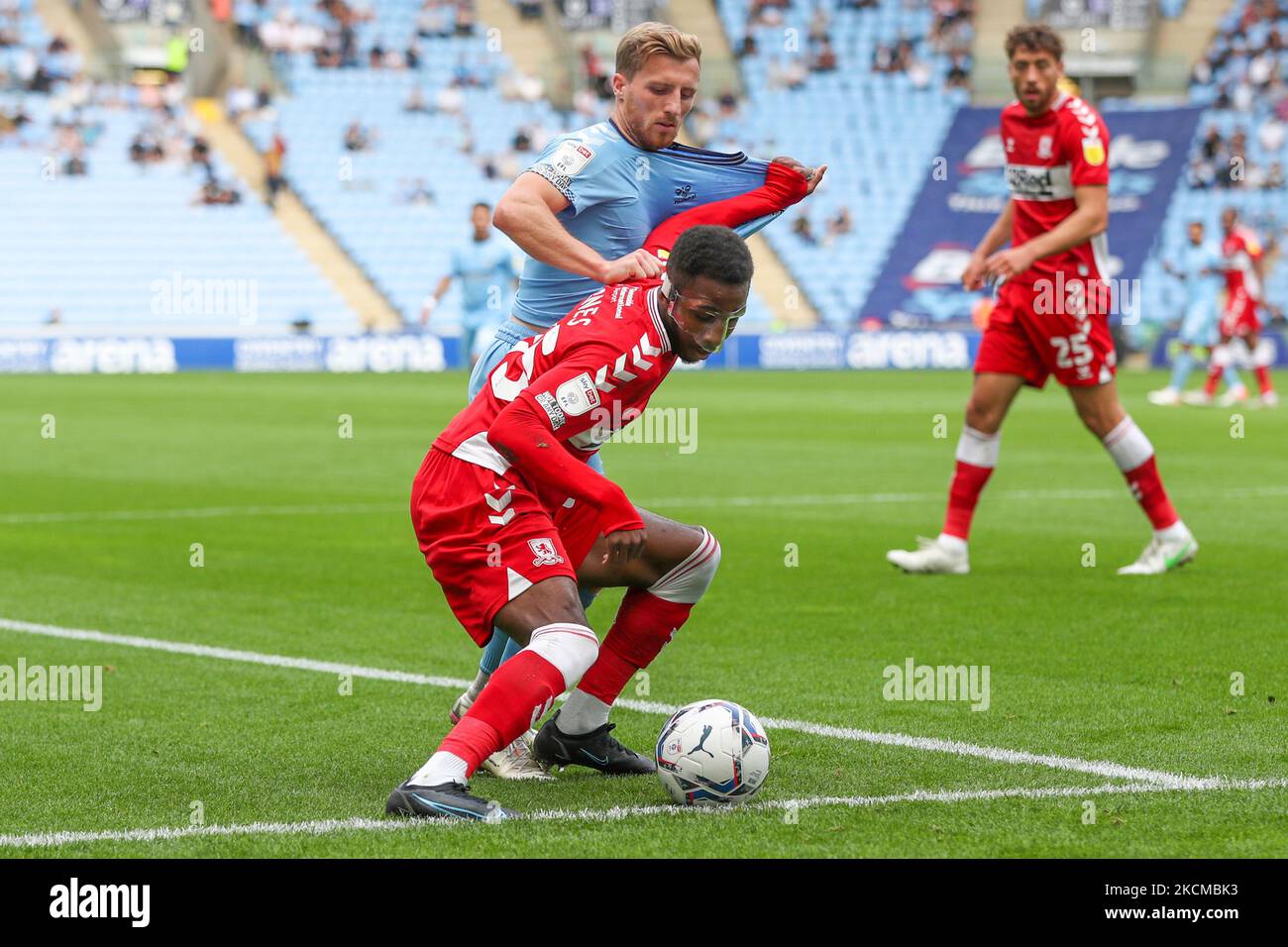 Middlesbrough's Isaiah Jones is challenged by Coventry City's Jamie Allen during the first half of the Sky Bet Championship match between Coventry City and Middlesbrough at the Ricoh Arena, Coventry on Saturday 11th September 2021. (Photo by John Cripps/MI News/NurPhoto) Stock Photo