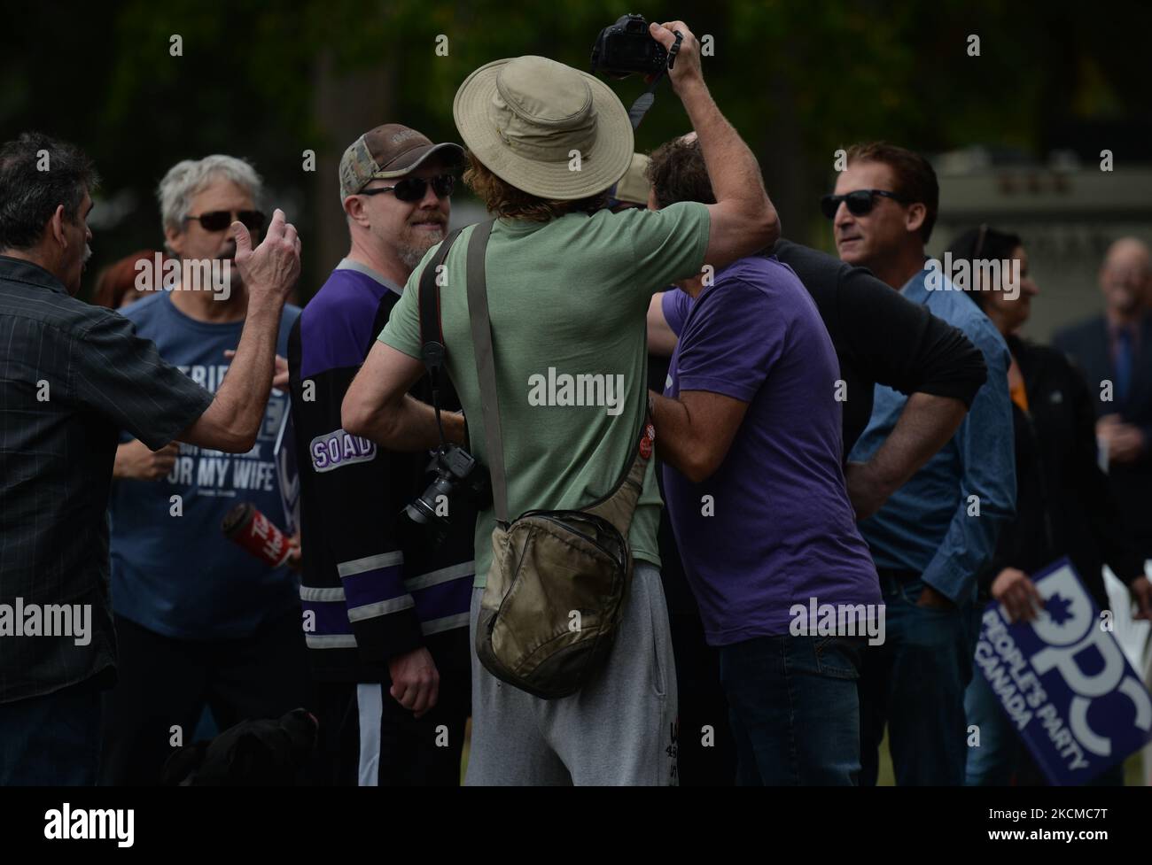 Local supporters of the People's Party of Canada seen in front of a counter-protester who is filming with his mobile phone during Maxime Bernier's address at an election rally in Borden Park, Edmonton, AB. On Saturday, 11 September 2021, in Edmonton, Alberta, Canada. (Photo by Artur Widak/NurPhoto) Stock Photo