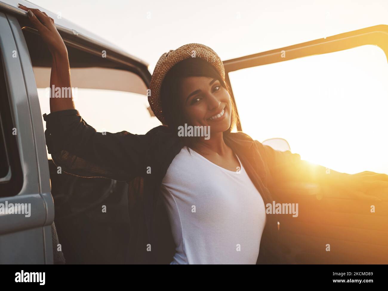 Summer activated. an attractive young woman enjoying a road trip Stock ...