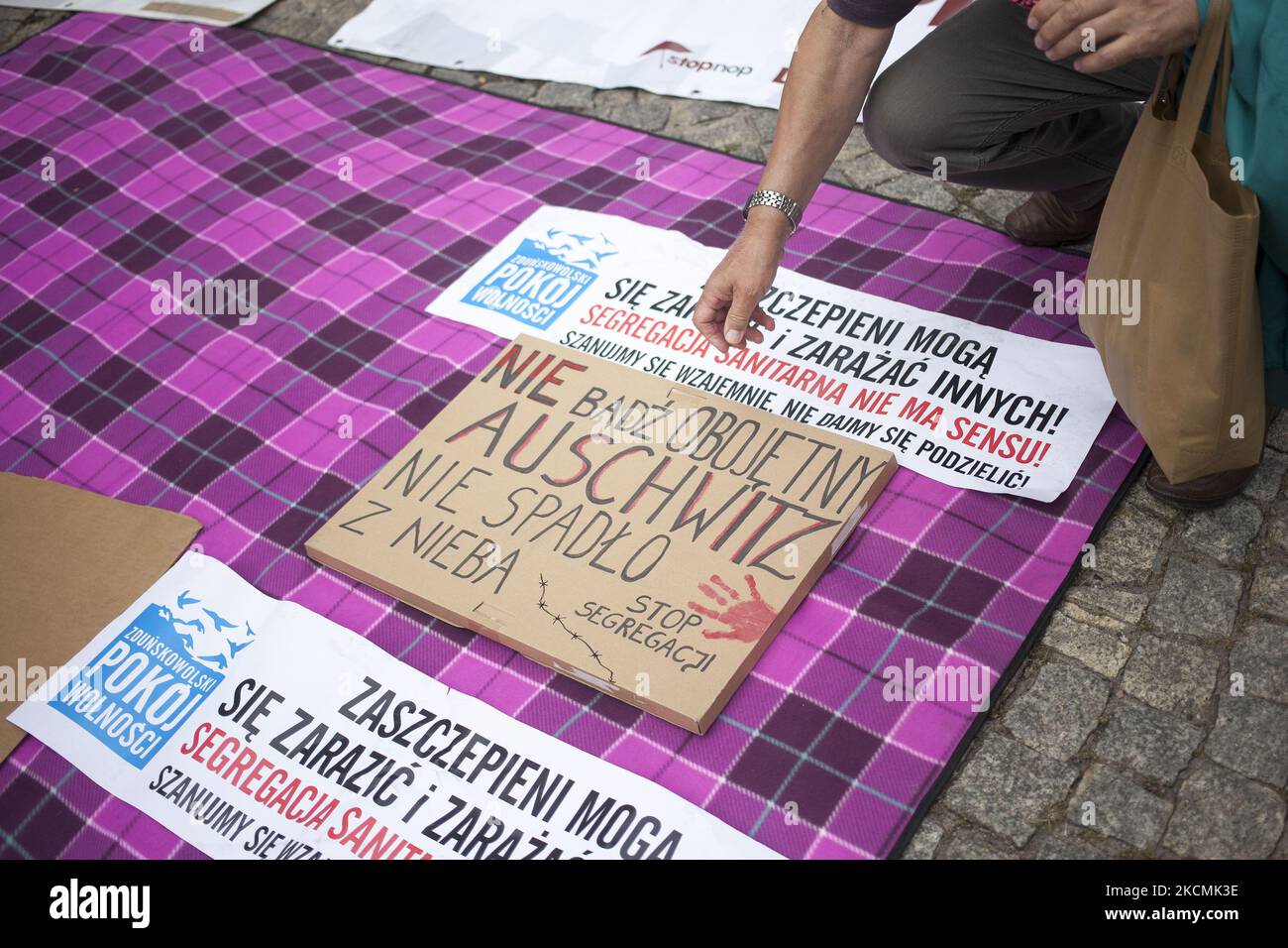 Do not be indifferent Auschwitz did not come from nowhere banner seen during protest against compulsory vaccination and sanitary segregation proposed in the so called Act 1449 in Warsaw on September 15, 2021. (Photo by Maciej Luczniewski/NurPhoto) Stock Photo