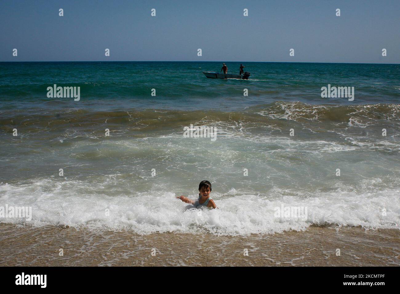 A boy plays in the sea amidst the Coronavirus pandemic in La Guaira, Venezuela on September 18, 2021. (Photo by Javier Campos/NurPhoto) Stock Photo