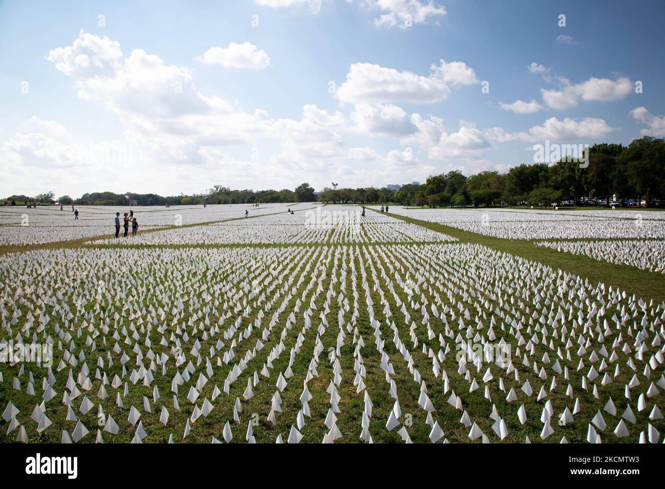 An exhibition of white flags representing more than 600,000 Americans who have died of COVID-19 covers more than 20 acres of the National Mall in Washington, D.C. on September 18, 2021. (Photo by Karla Ann Cote/NurPhoto) Stock Photo