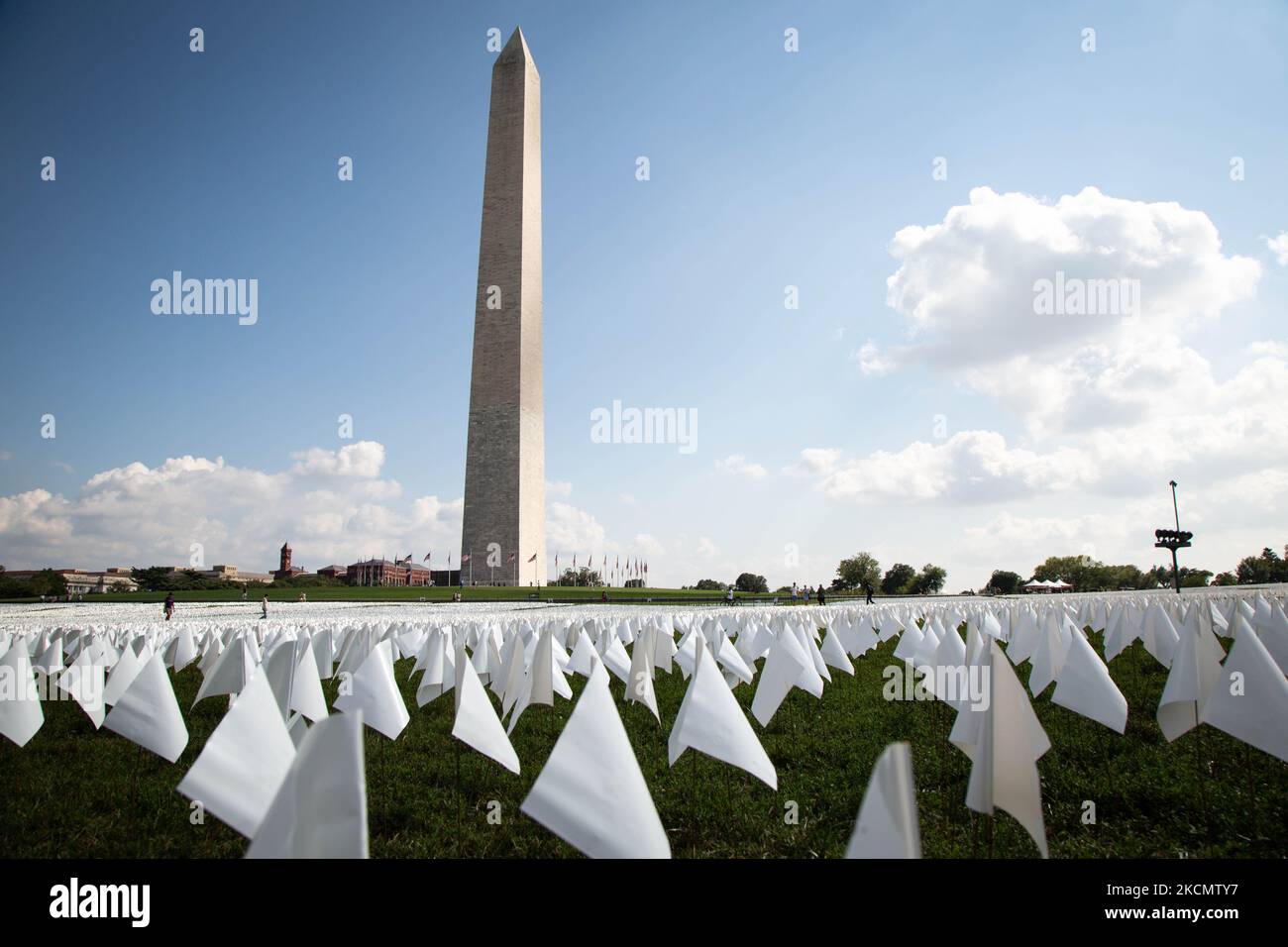 An exhibition of white flags representing more than 600,000 Americans who have died of COVID-19 covers more than 20 acres of the National Mall in Washington, D.C. on September 18, 2021. (Photo by Karla Ann Cote/NurPhoto) Stock Photo