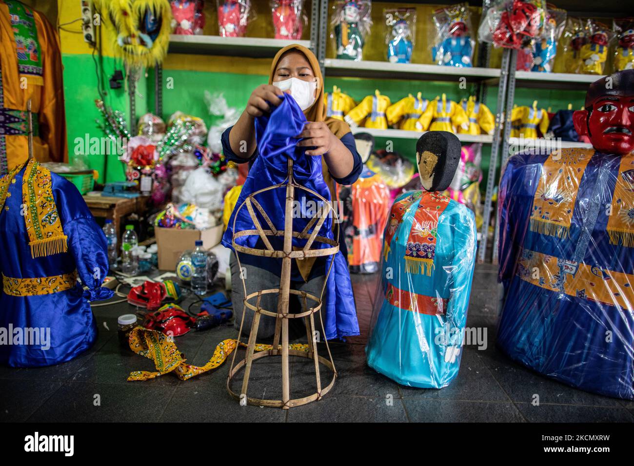 Manufacture and sale of Ondel-Ondel, a traditional Betawi-Jakarta doll toy. After the decline in COVID-19 cases in Jakarta, the tourism sector began to revive, one of which is the ondel-ondel producer and seller in Jagakarsa, sales increased by 20%. (Photo by Donal Husni/NurPhoto) Stock Photo