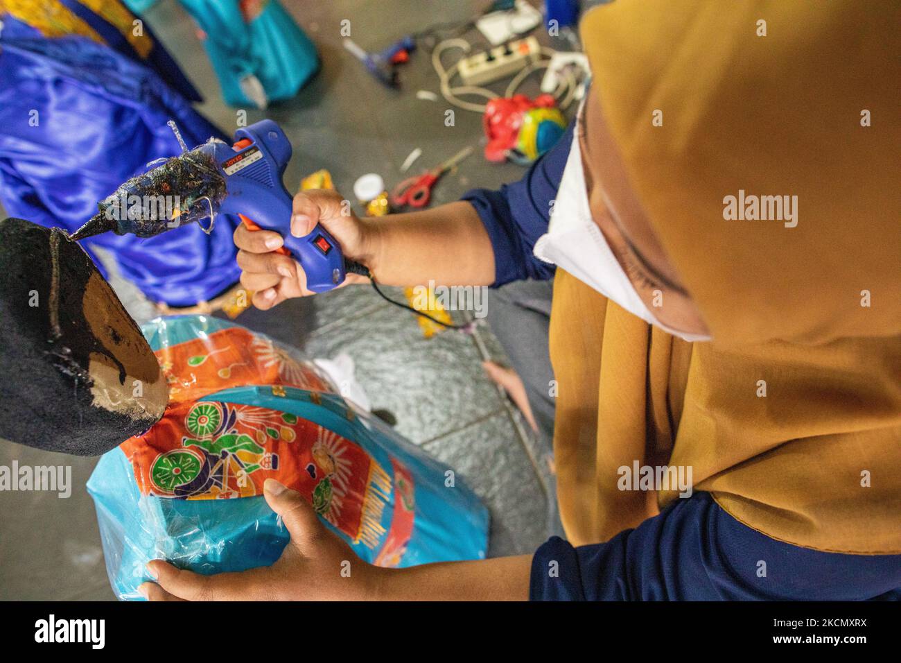 Manufacture and sale of Ondel-Ondel, a traditional Betawi-Jakarta doll toy. After the decline in COVID-19 cases in Jakarta, the tourism sector began to revive, one of which is the ondel-ondel producer and seller in Jagakarsa, sales increased by 20%. (Photo by Donal Husni/NurPhoto) Stock Photo