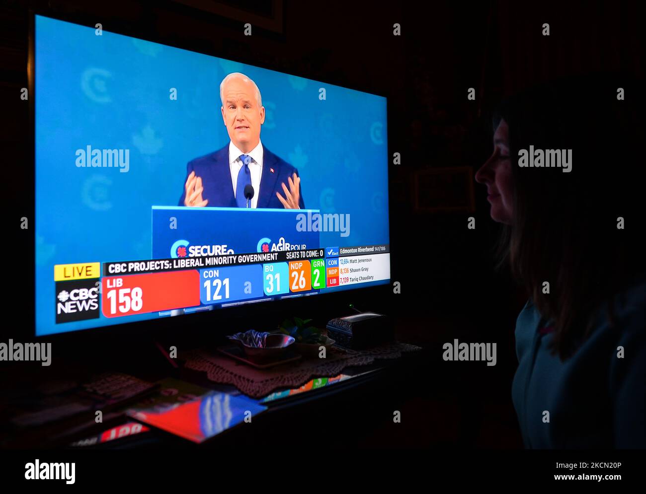 A woman watches Conservative Party of Canada leader Erin O'Toole speaking during a televised address on election night on CBC News. Early election results predict Liberal leader Justin Trudeau to win enough seats in this 44th general election to form another minority government On Monday, September 20, 2021, in Edmonton, Alberta, Canada. (Photo by Artur Widak/NurPhoto) Stock Photo