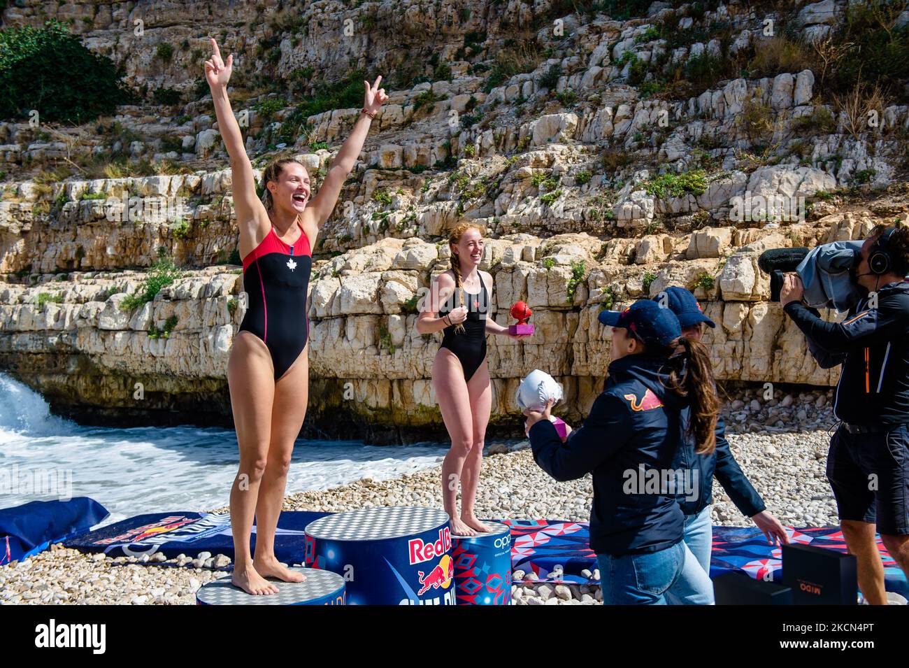 The divers on the podium in Polignano a Mare during the Red Bull Cliff Diving 2021 at Lama Monachile on 22 September 2021. Red Bull Cliff Diving has arrived in Puglia, in Polignano a Mare, in the suggestive glimpse of Lama Monachile. Twelve male and twelve female athletes dived from 27 and 21 meters in a spectacular series of competitive dives. (Photo by Davide Pischettola/NurPhoto) Stock Photo