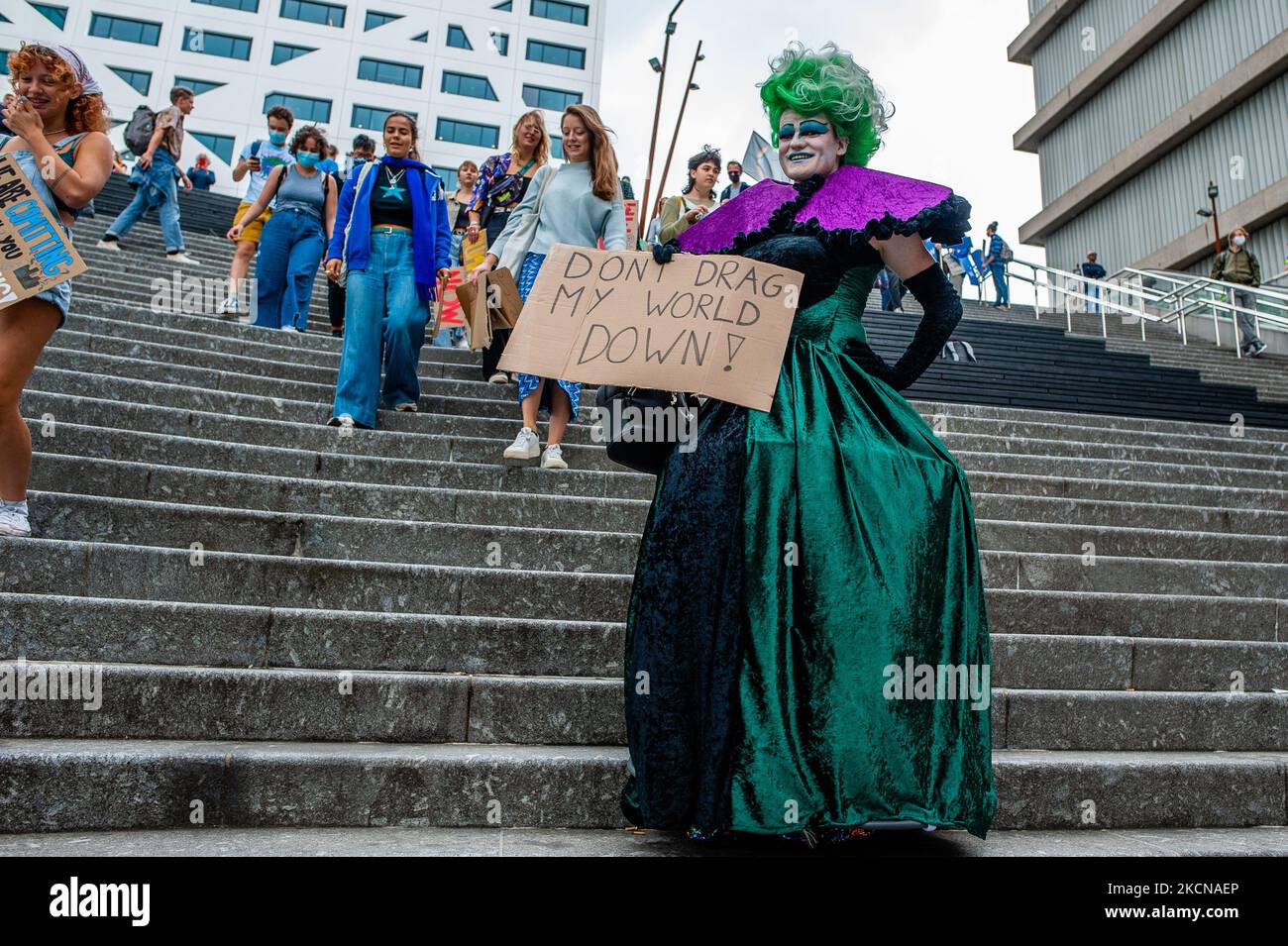 A drag queen is walking down the stairs with a placard in support of the climate, during the Global Climate Strike organized in Utrecht, on September 24th, 2021. (Photo by Romy Arroyo Fernandez/NurPhoto) Stock Photo