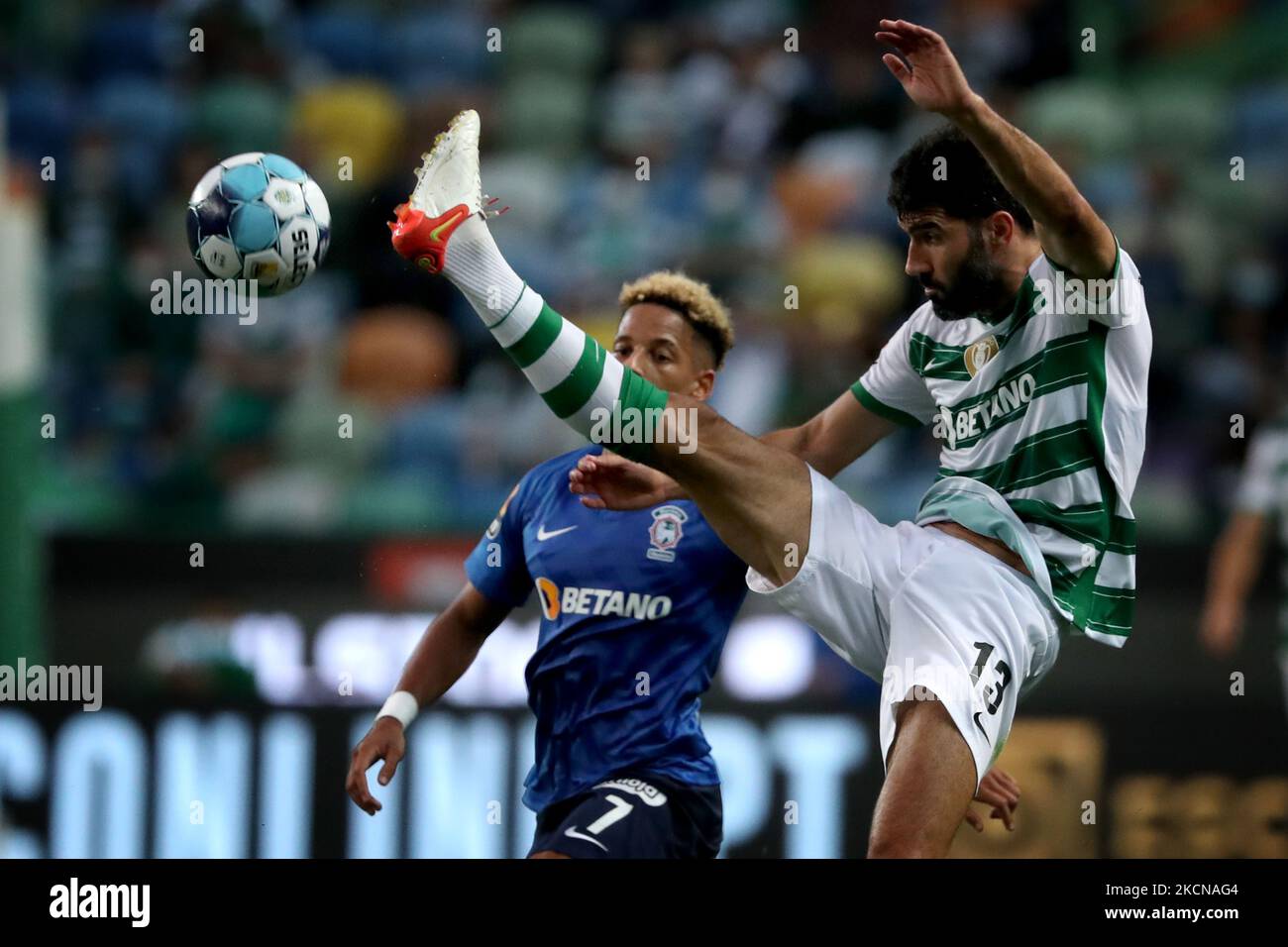 Luis Neto of Sporting CP (R ) vies with Andre Vidigal of CS Maritimo during the Portuguese League football match between Sporting CP and CS Maritimo at Jose Alvalade stadium in Lisbon, Portugal on September 24, 2021. (Photo by Pedro FiÃºza/NurPhoto) Stock Photo