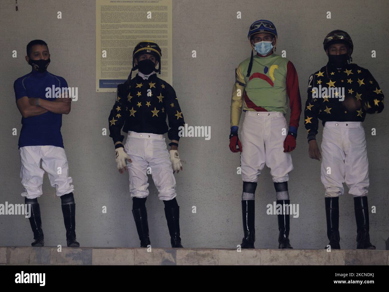 A group of jockeys at the Hipódromo de las Americas in Mexico City, prior to a race on the occasion of the LXXVI Handicap of the Americas 2021 during the COVID-19 health emergency and the yellow epidemiological traffic light in the capital. (Photo by Gerardo Vieyra/NurPhoto) Stock Photo